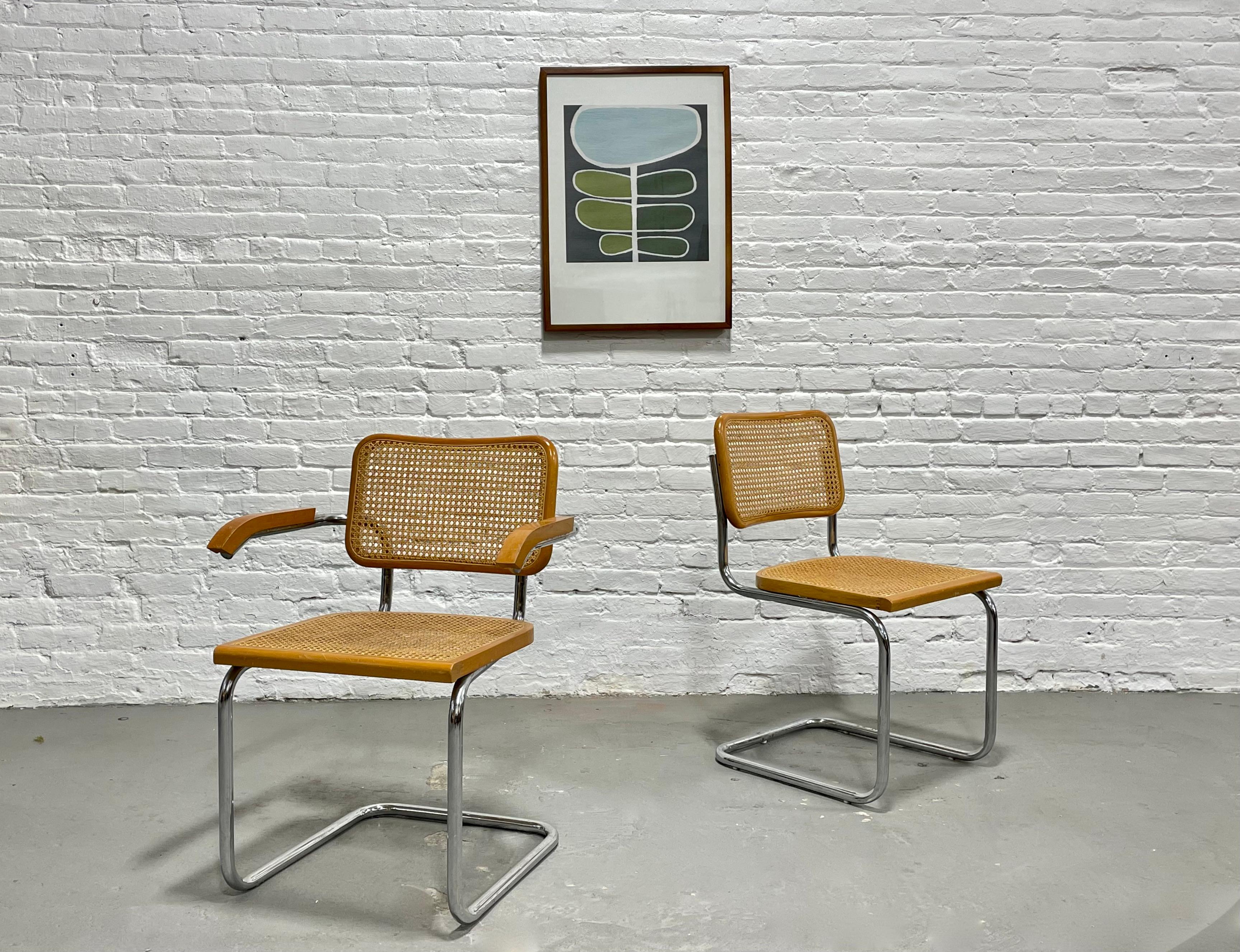 Marcel Breuer Cesca styled Mid Century Modern dining chairs, a Pair. The frames are constructed of tubular steel and the caned backs are unbroken and lovely, with finger joint detailing along the seat edges. Lovely vintage condition with some wear