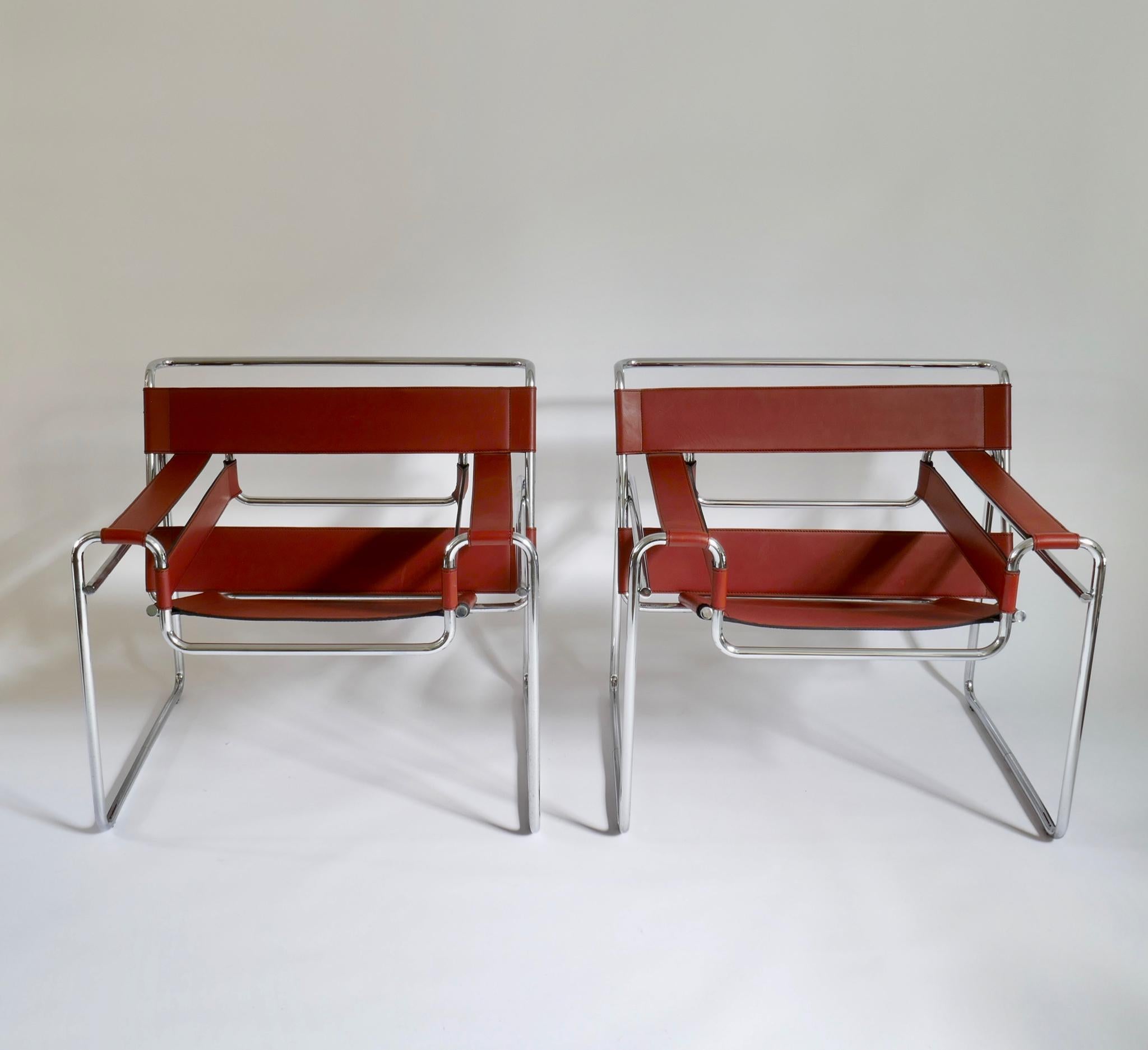 Pair of Marcel Breuer style brown or burgundy leather wassily chairs.