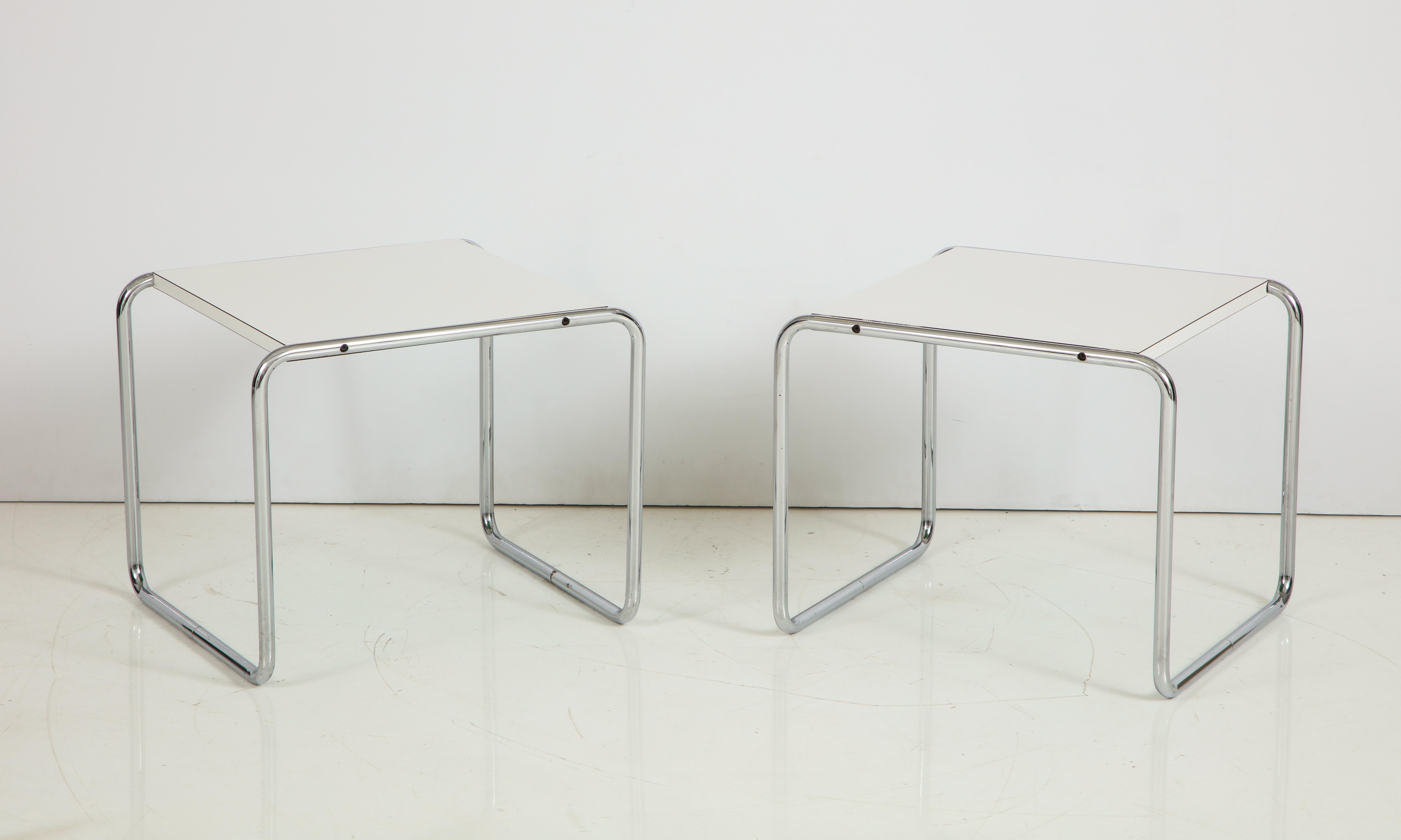 Designed by Marcel Breuer in 1925 to accompany the Wassily chair, this pair of
side tables or stools of tubular steel were manufactured by Knoll in the 1970s; with white Formica tops, the underside in green which can be interchangeable. All