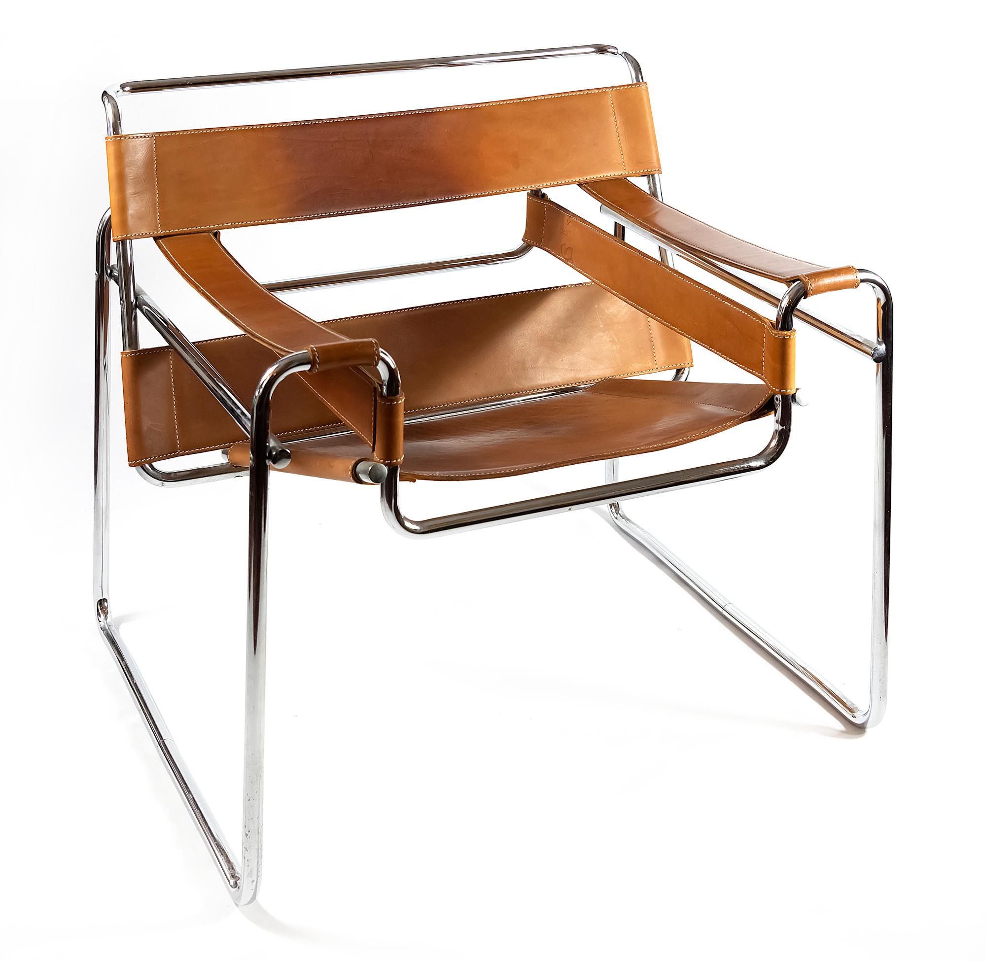 Pair of Wassily Chairs, designed by Marcel Breuer around 1925.
Manufactured circa 1980s, brown (cognac) leather, chromed steel tube frame.

