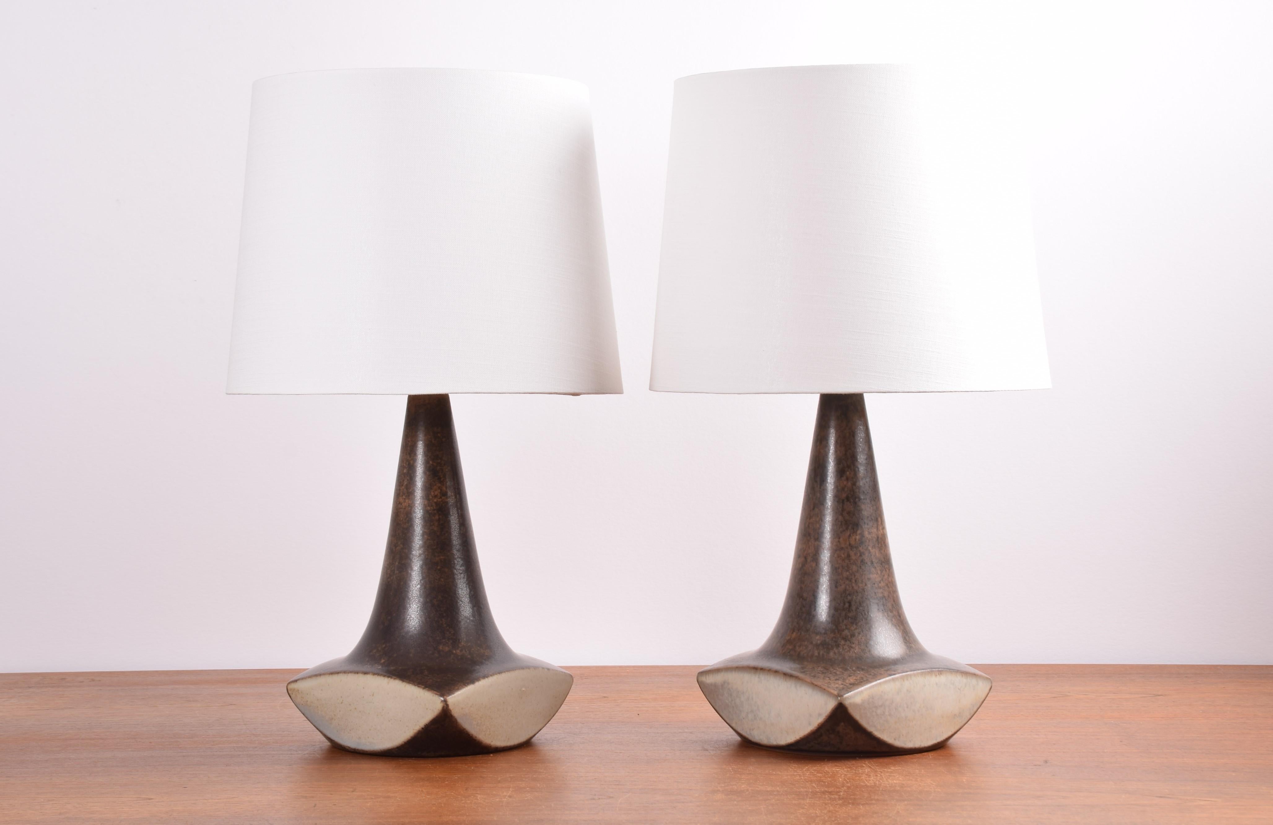 Pair of Danish mid-century sculptural table lamps by Marianne Starck for Michael Andersen & Søn.
Brown and beige sand colored glaze.
Made circa 1960s. 

One of the lamps wears original MA&S paper sticker, the other is marked with MS (for
