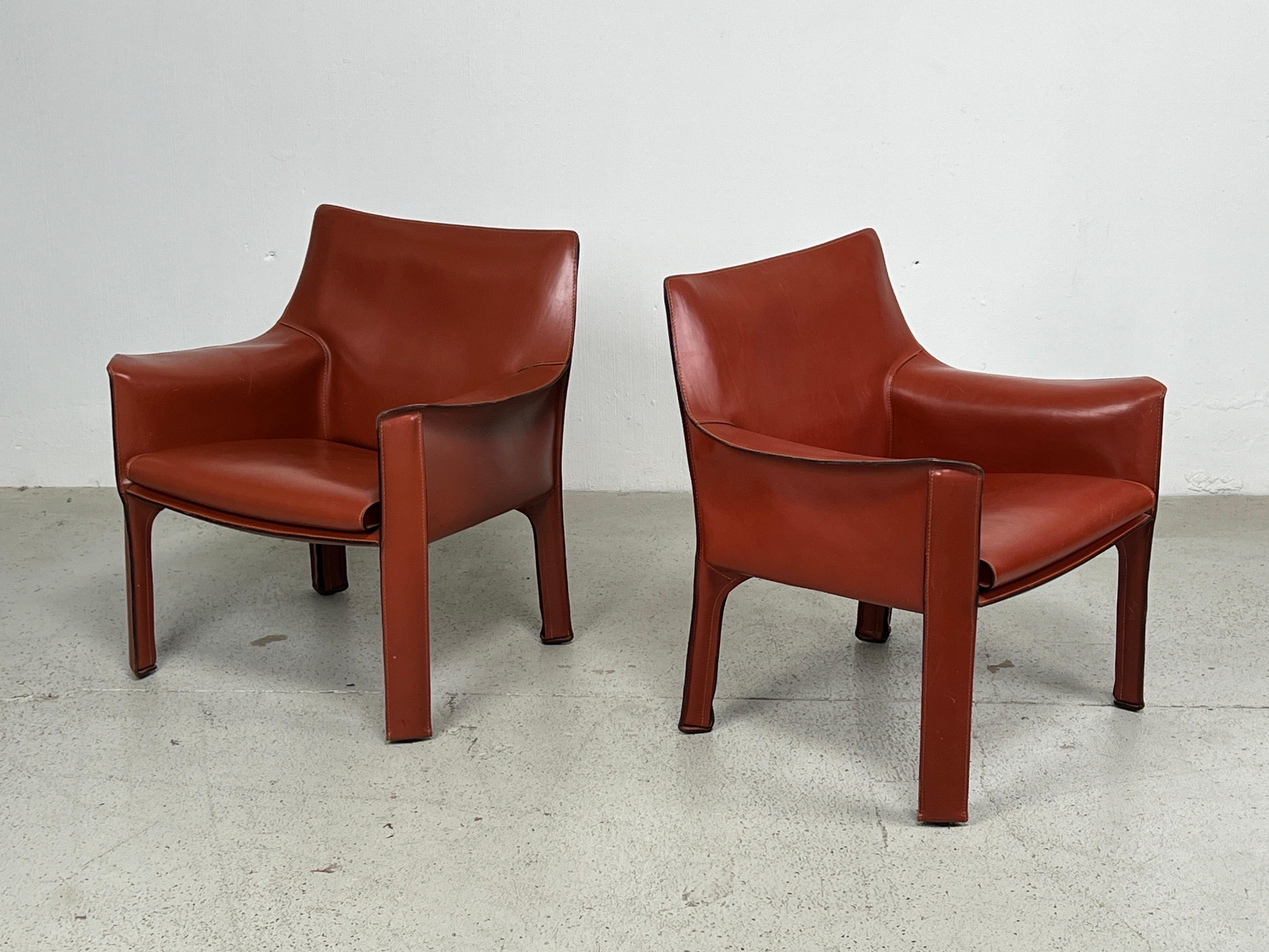 Pair of Mario Bellini for Cassina Cab 414 lounge chairs in China red/Oxblood leather.