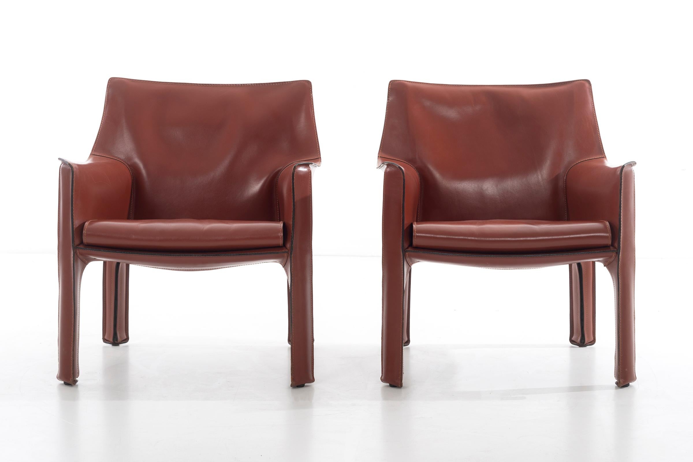 Bellini for Cassina, Cab Chairs in Cognac Italian Leather, High-Quality Chairs consists of a leather cover stretched over a minimal tubular steel frame. The only additional reinforcement is provided by a rubber membrane plate that supports the