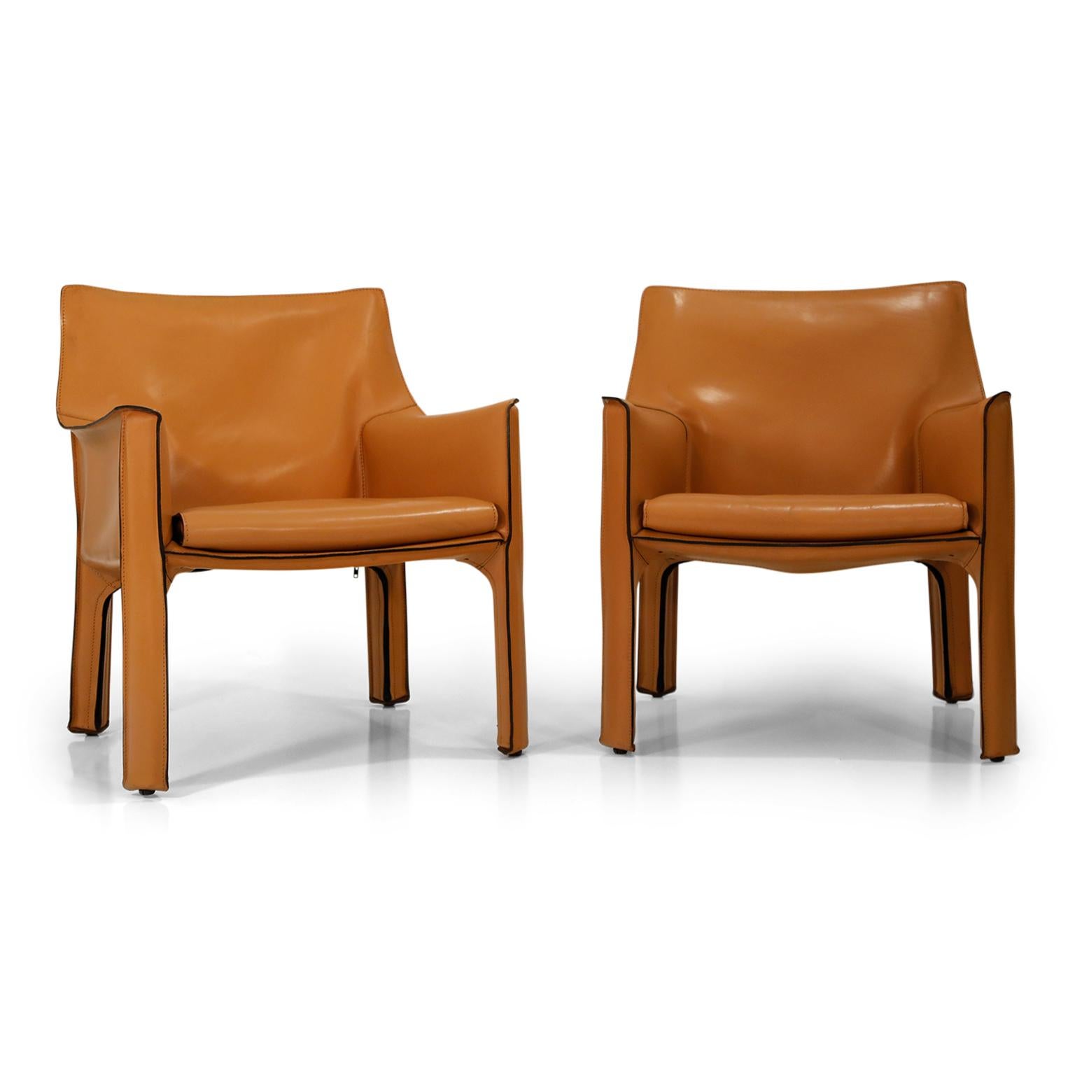 A beautiful pair of Mario Bellini Cab lounge chairs in exemplary condition, signed Cassina, designed and produced in the 1970s and priced for the pair of two (2) chairs. The lounge armchairs are similar to the Classic dining armchair counterpart but