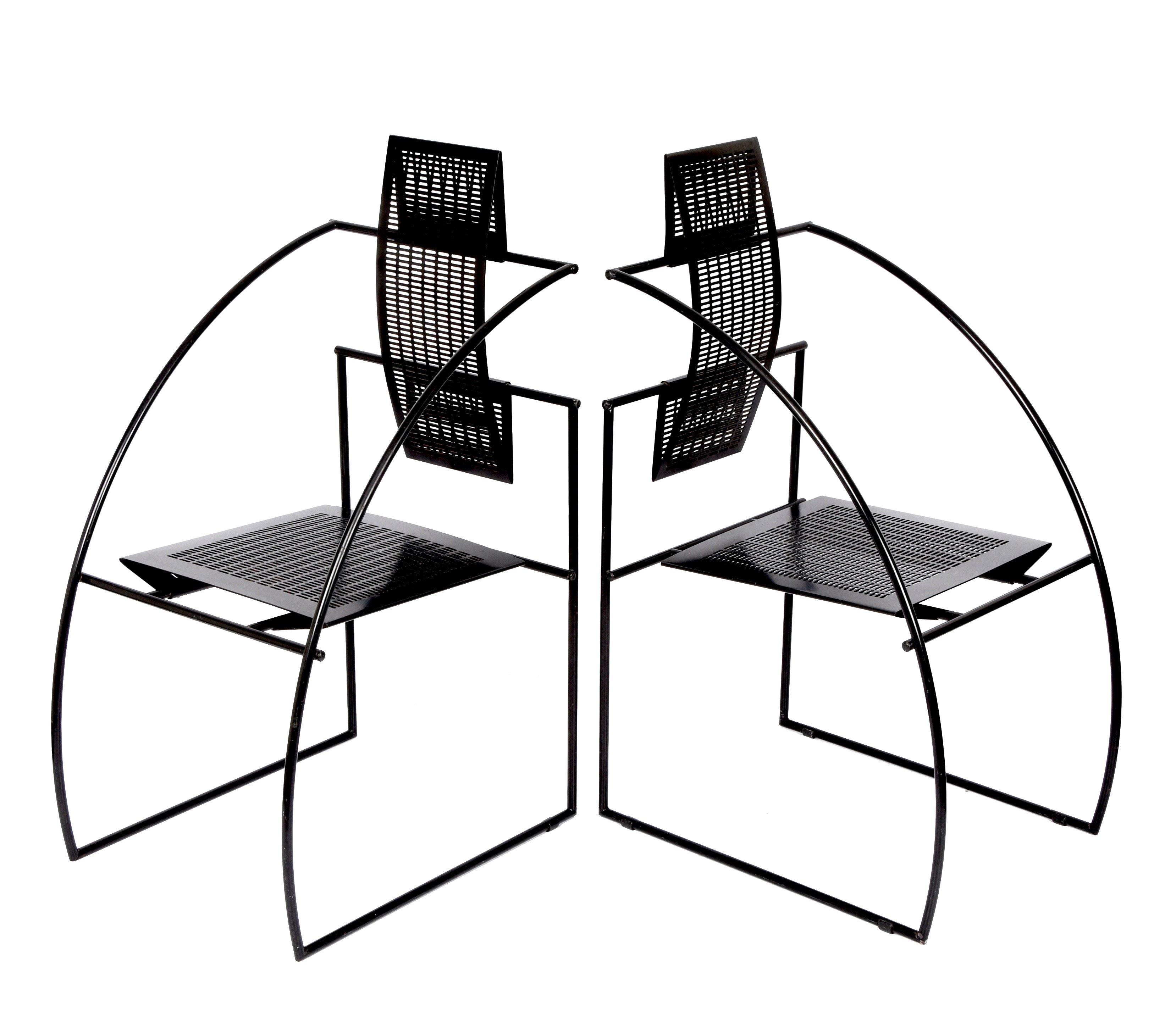 Amazing Quinta chairs designed by the Swiss architect and designer Mario Botta in Italy in 1985. This pair of chairs is made of a steel rod frame and perforated steel to form the seat and back.

In good vintage condition, this pair of chairs is no
