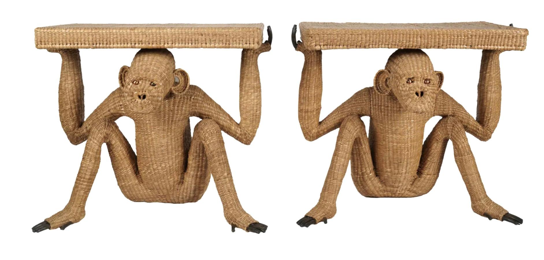 Pair of Console Tables by Mexican Artist, Mario Lopez Torres.  The tables are held by a hand-woven rattan monkey -  A steel frame with Hand-woven rattan is the base and body, while the hands feet and eye are steel and brass.  The Monkey holding the