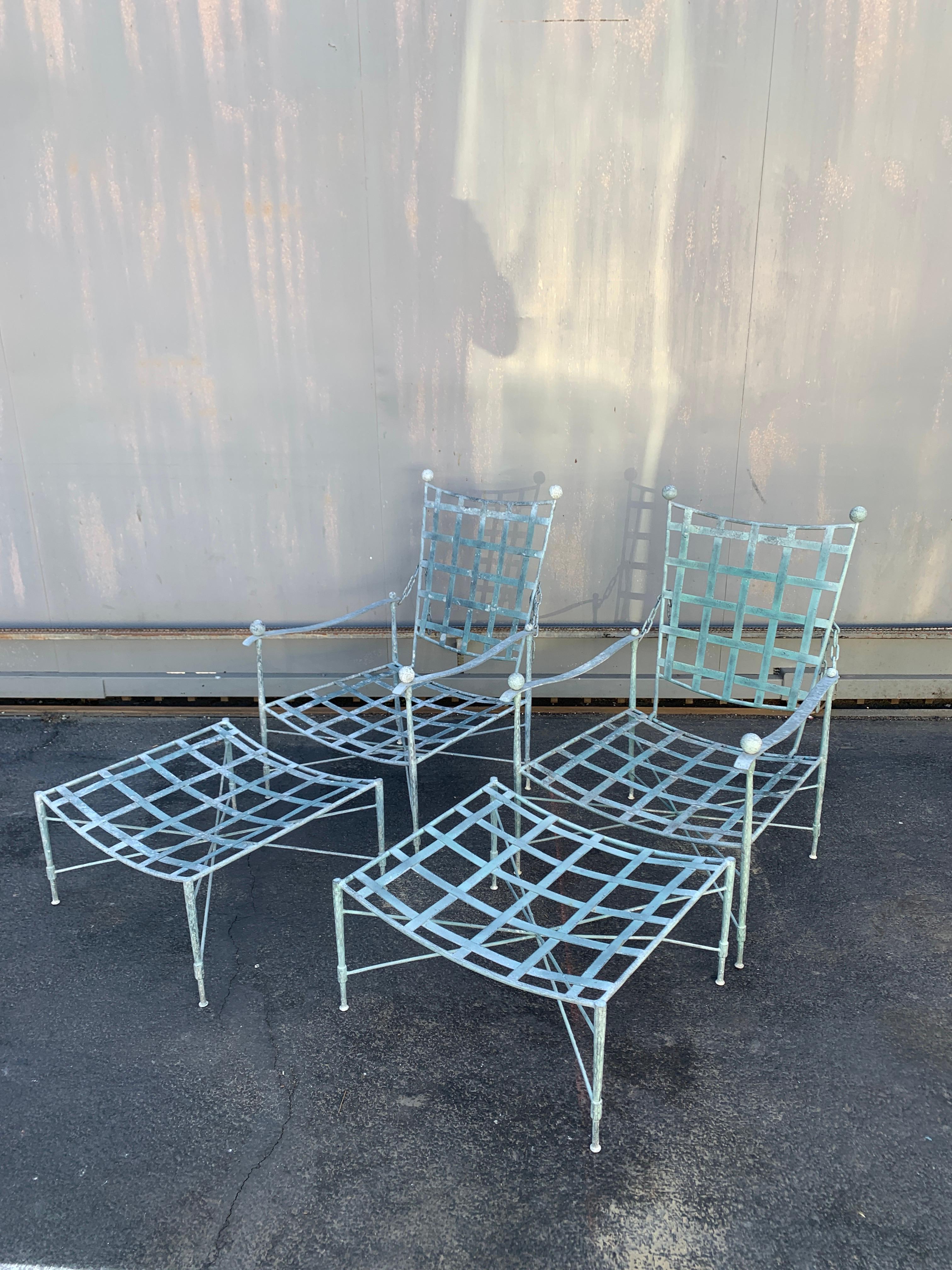 Pair of Mario Papperzini chairs and ottomans for John Salterini - beautifully patinated and difficult to find, we are offering a pair of Salterini Patio Chairs in a wonderful Verdigris Green original finish. The chairs have the iconic chains on the
