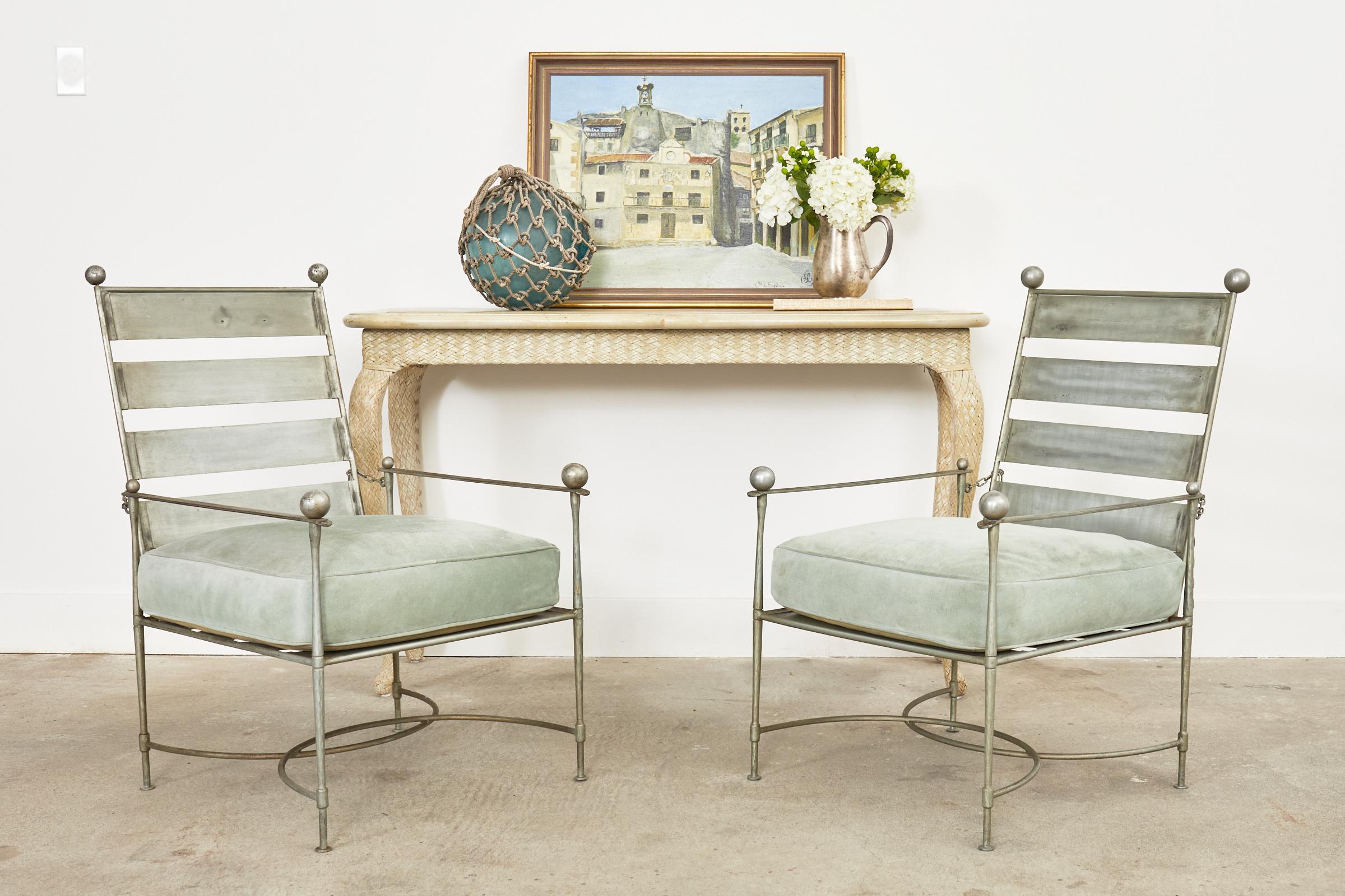 Rare pair of iconic reclining garden lounge chairs by Mario Papperzini for John Salterini. The mid-century modern chairs feature a gorgeous nickel finish with slat ladder back style supports. The generous seats are topped with thick cushions covered