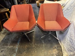 Pair of maroon Keilhauer Swivel Lounge Chairs