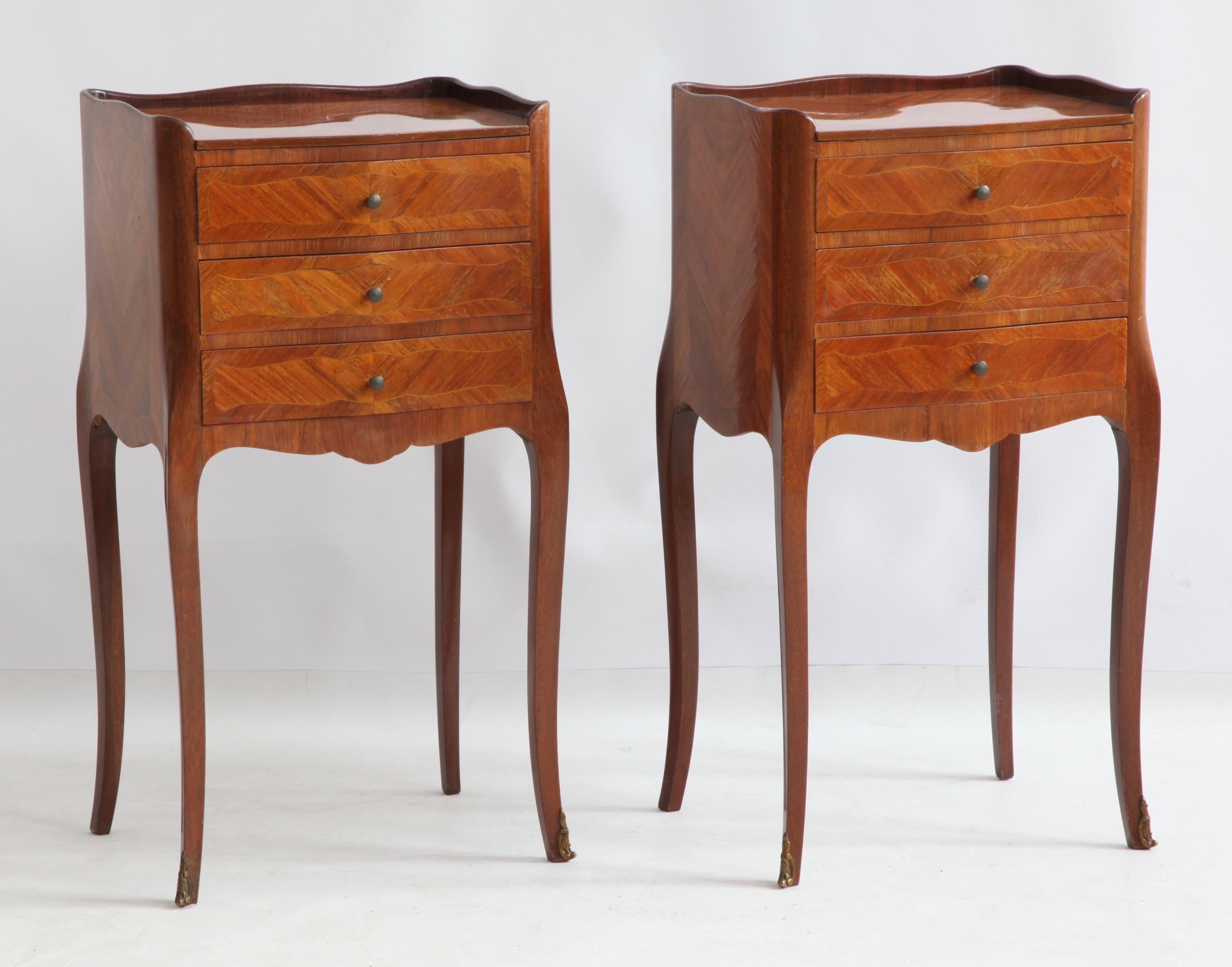 Pair of Louis XV style bedside tables.
Marquetry work with 3 drawers.
Serpentine legs with diamond shape top.