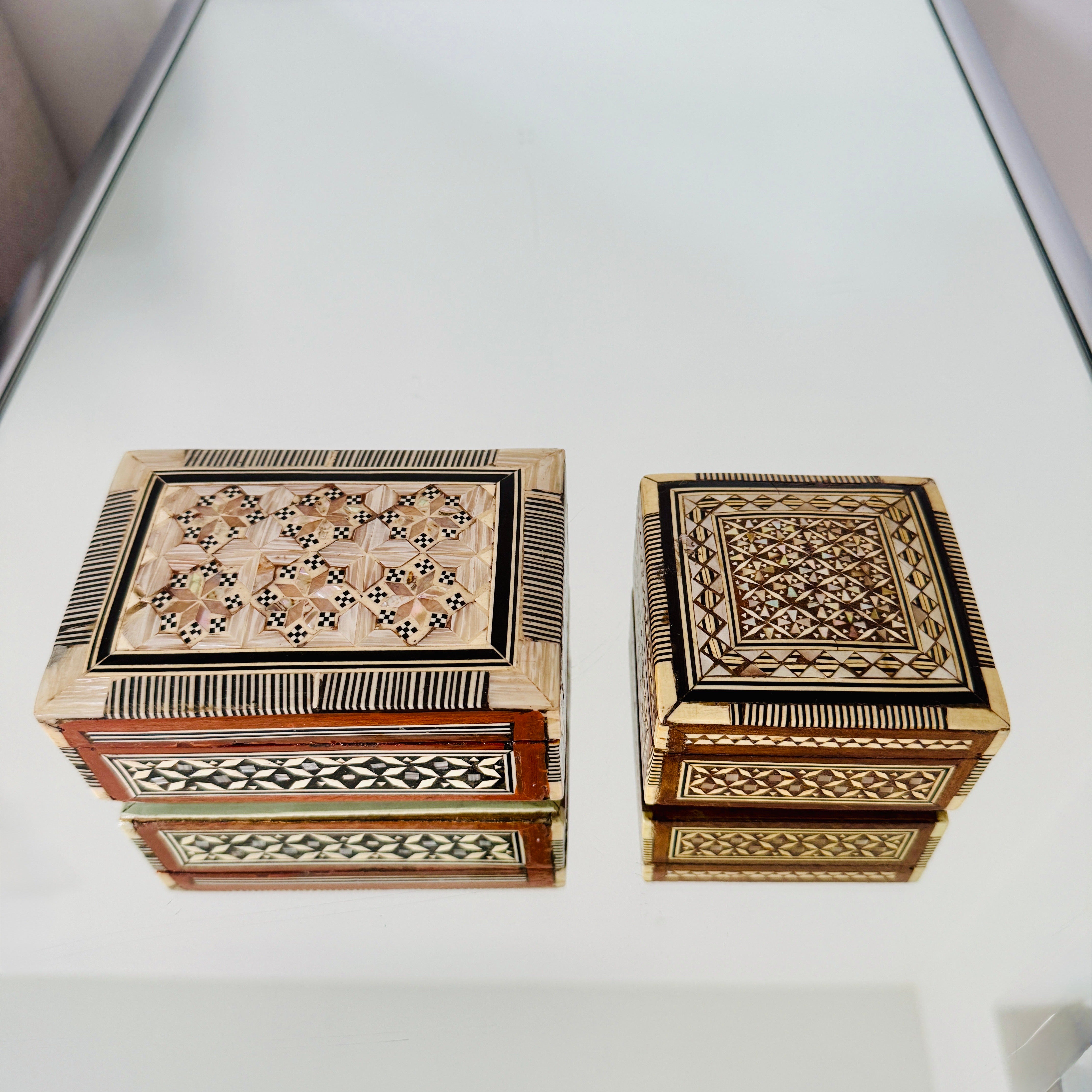 Exquisite handcrafted Khatam wood boxes with micro mosaic marquetry design, an Ancient Persian technique of inlaying.  Moorish style boxes feature geometric inlays of wood, bone, and mother of pearl.  Artisanal craftsmanship with hinged lids and