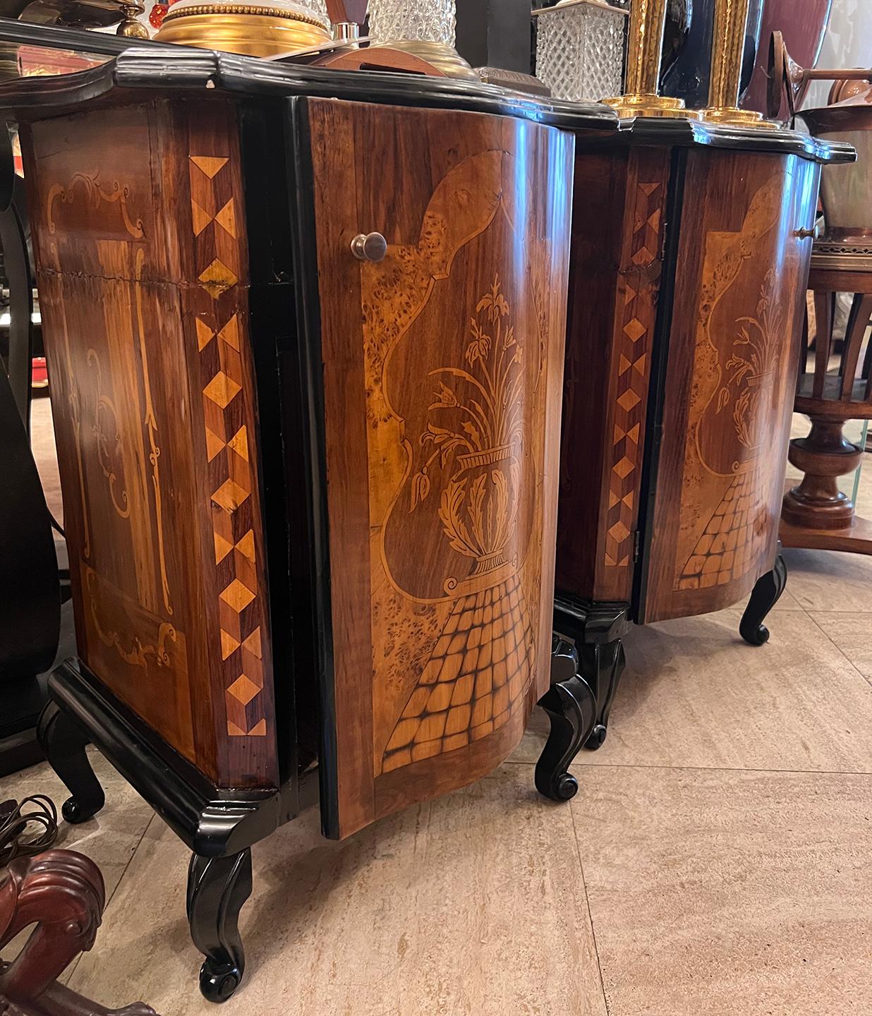Pair of circa 1900 Italian marquetry nightstands.

Measurements:
Height 29.5