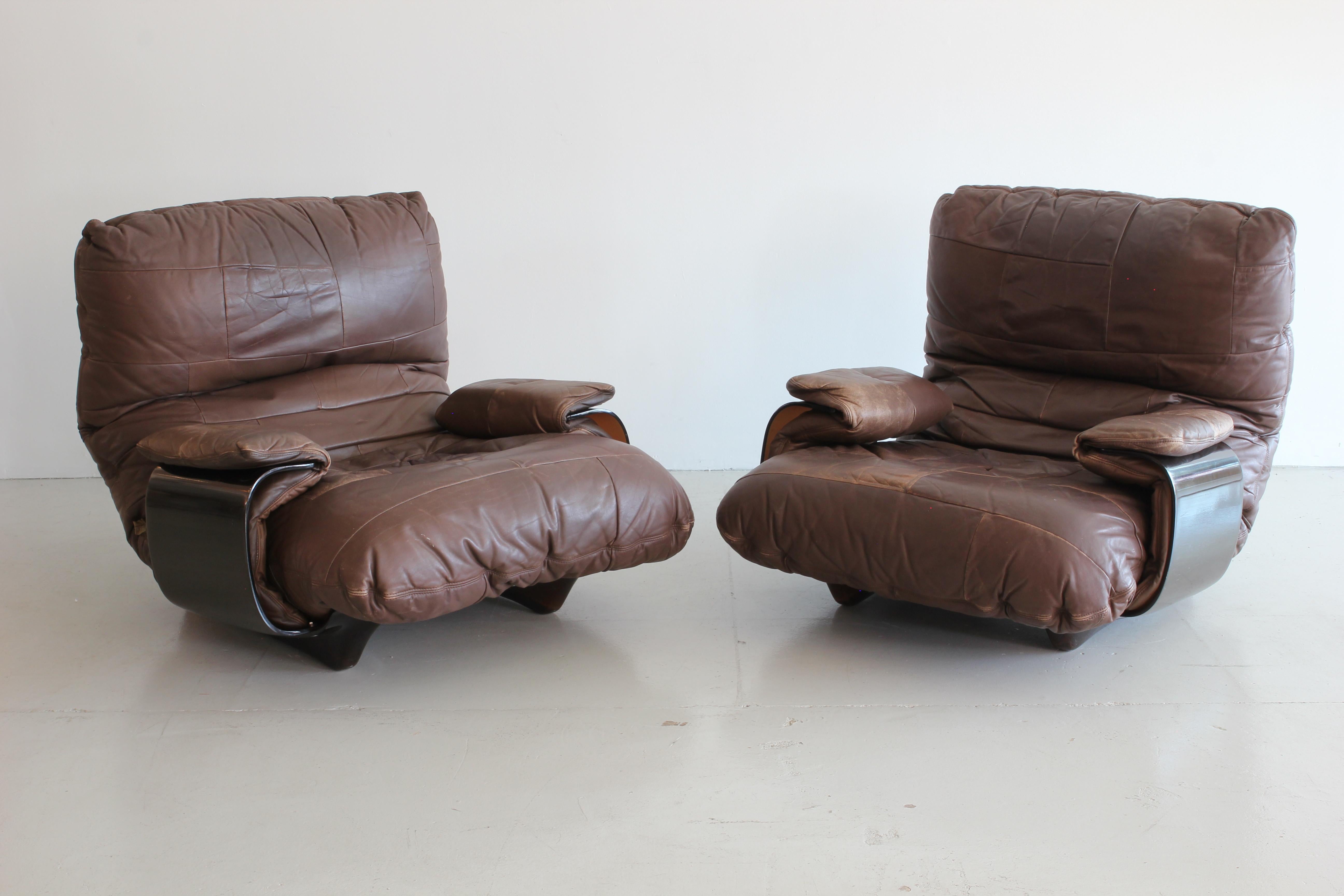 Pair of incredible Marsala lounge chairs by Michel Ducaroy manufactured by Ligne Roset in France during the 1970s. Original leather and logo on upholstery and frame. Sold as a pair.