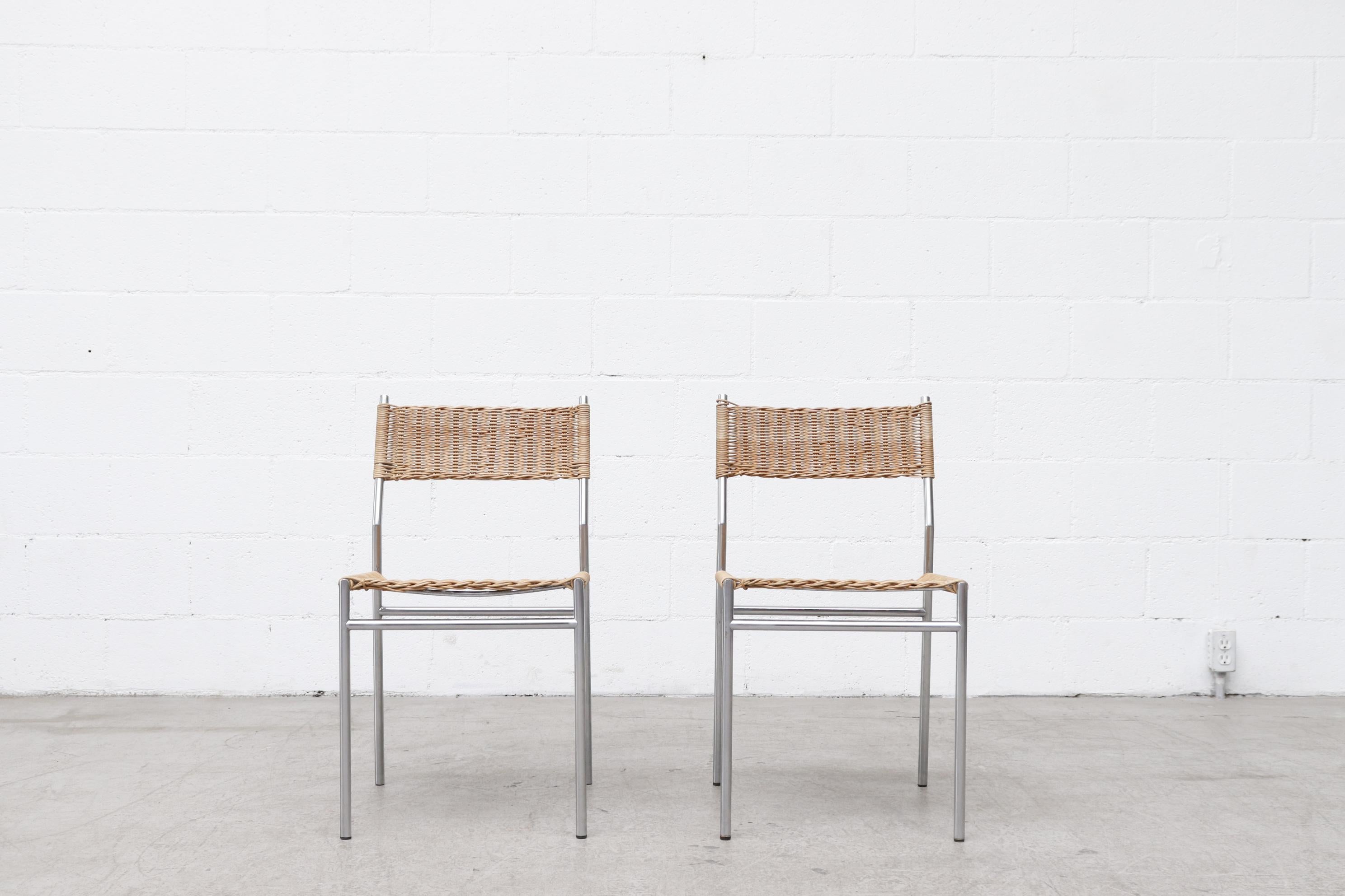 Pair of Martin Visser chrome framed dining chairs with woven wicker seat and backrest. In good original condition with wear consistent with their age and use including some wicker breakage. Set price. A set of 6 is available (LU922421027552) and