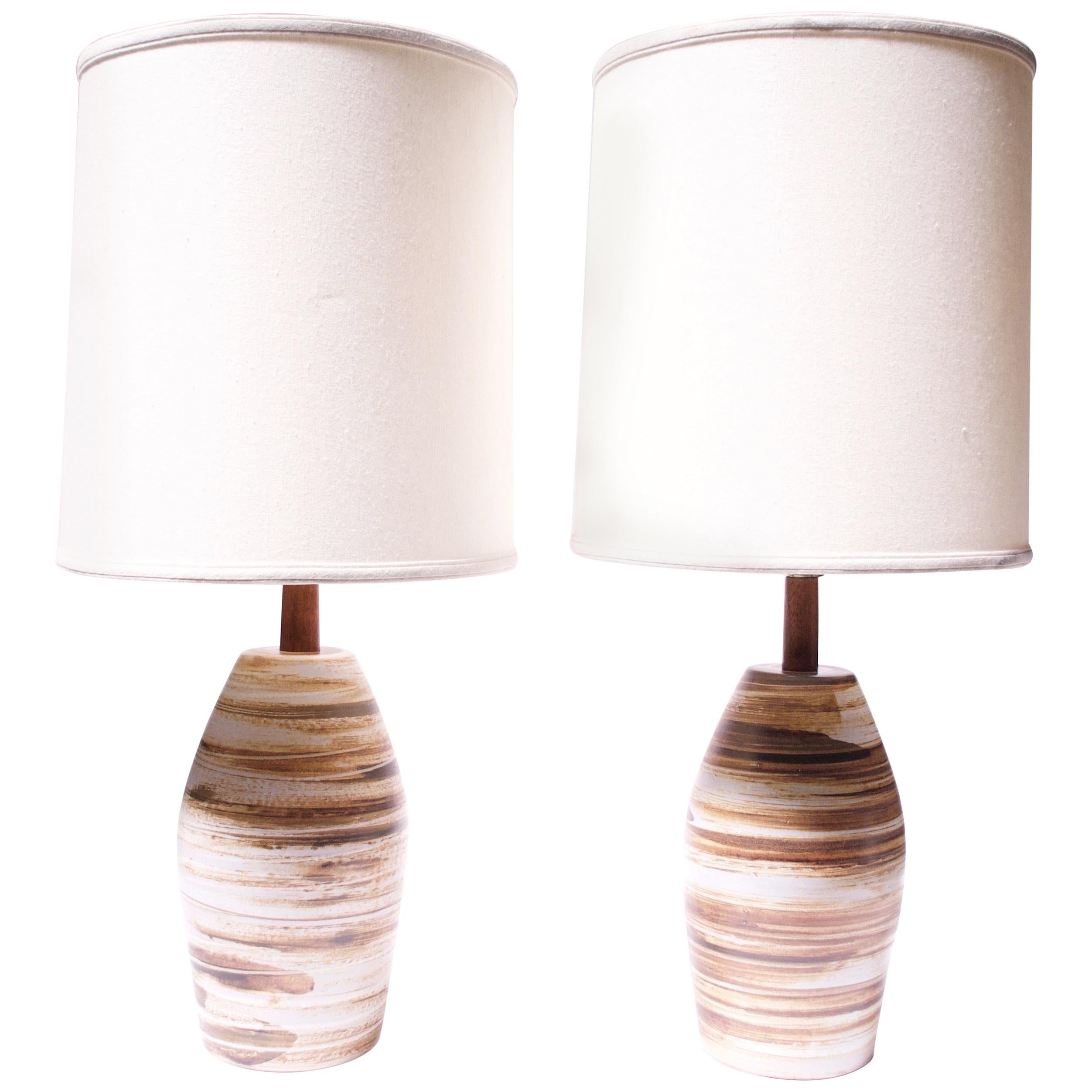 These Gordon and Jane Martz for Marshall Studios table lamps (model #267-28-D116A) feature a matte base in contrasting swirls of tan, brown, cream, and dark green. Etched 'Martz' signature present to both.
Given the handmade nature of these items,