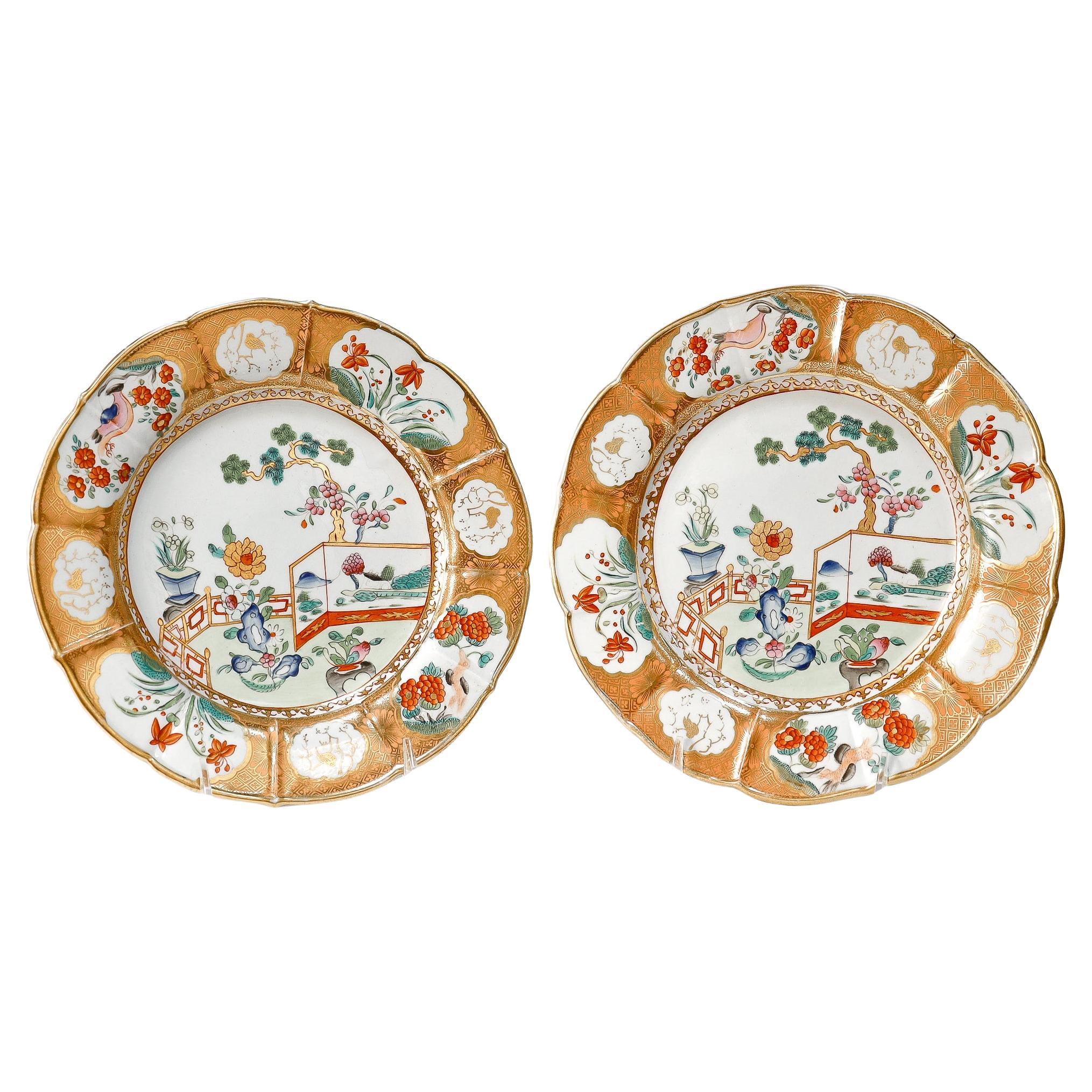 Pair of Mason
s Ironstone Gilt Chinoiserie Garden Scene Plates with Orange Rims For Sale