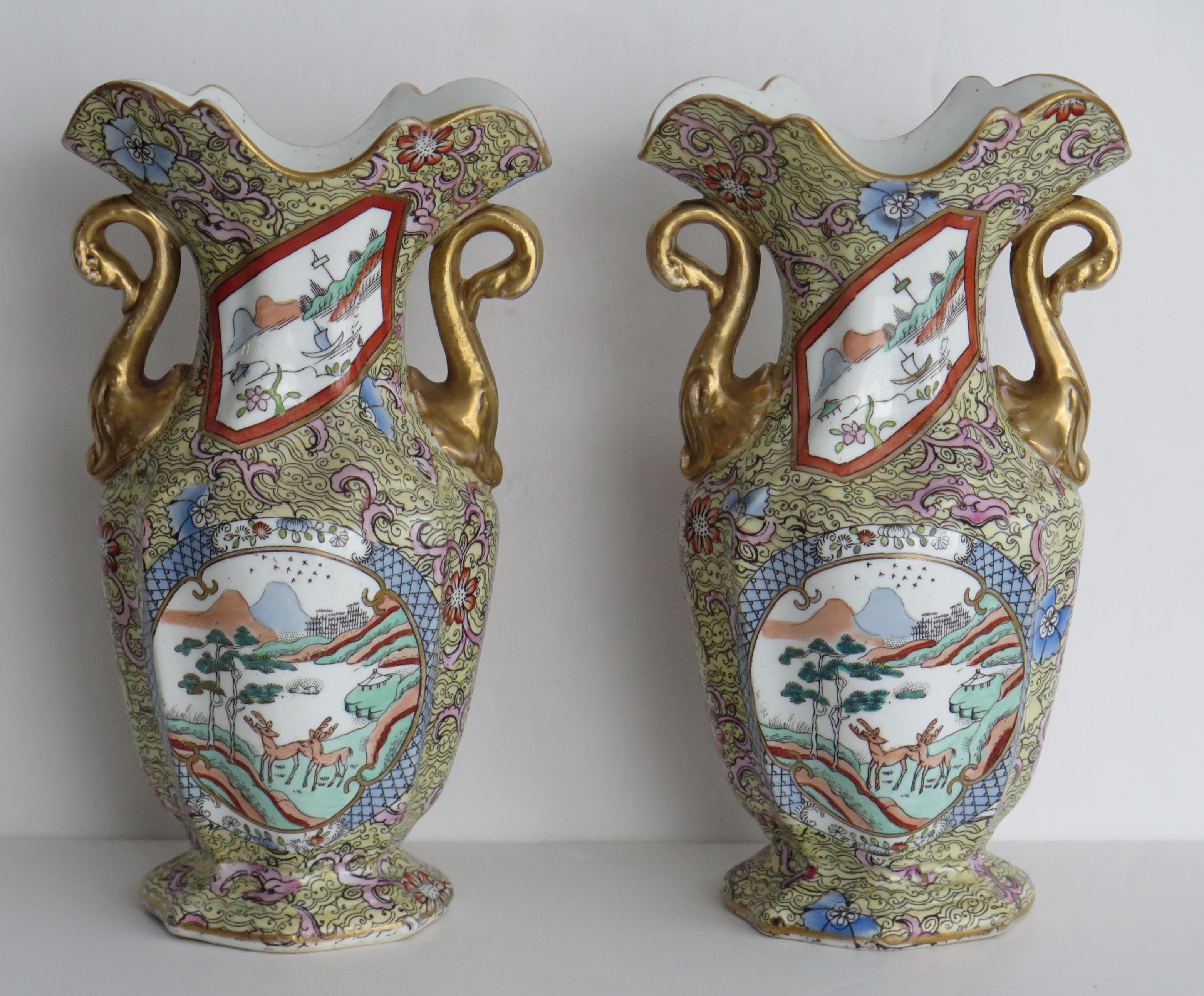 These are a rare and very decorative pair of ironstone twin handled vases made by the English Mason's Ironstone factory, dating to the late Georgian period, circa 1820.

The body is well potted with a hexagonal baluster form, a flaired wavy rim