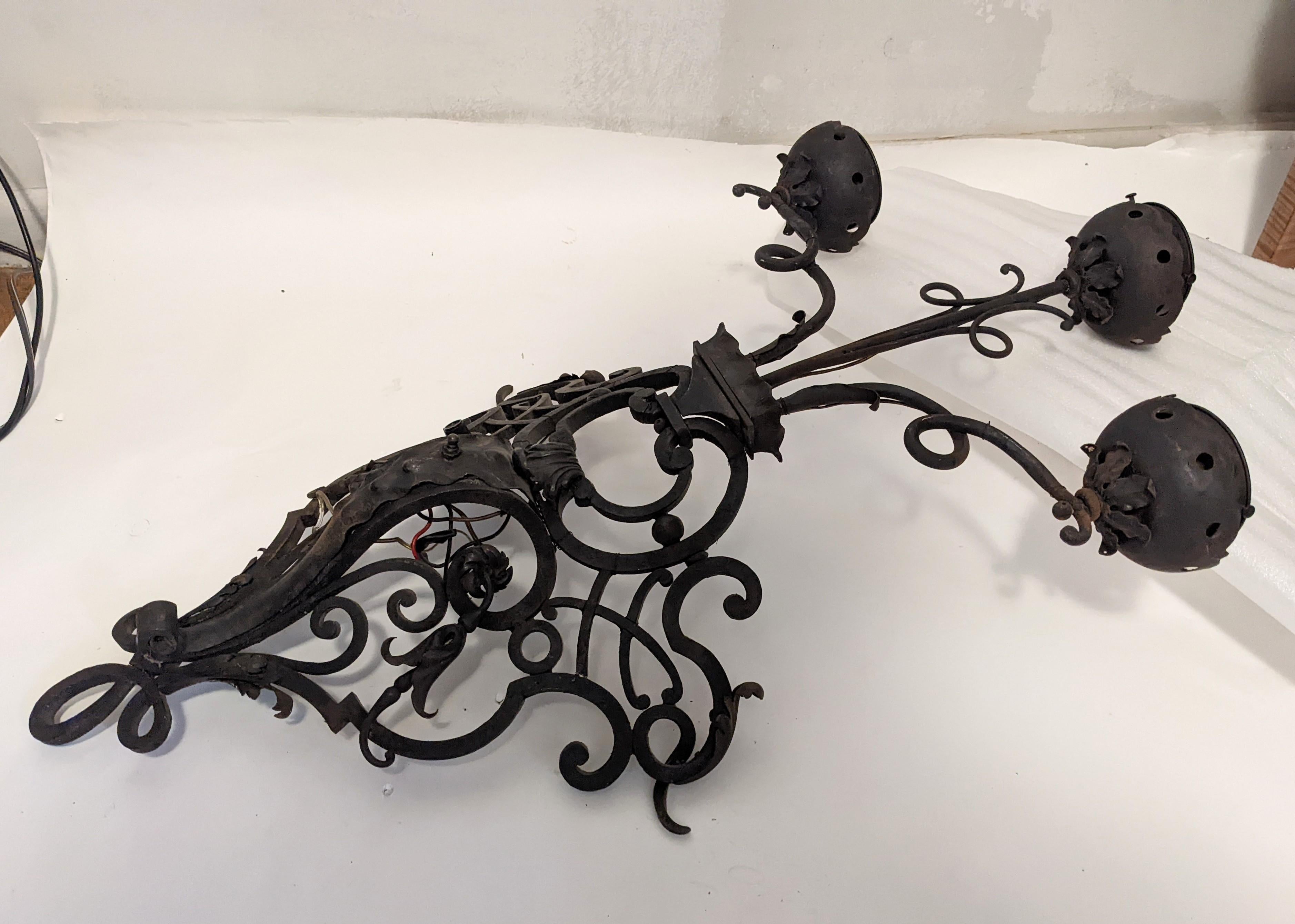 Baroque Revival Pair of Massive French Wrought Iron Sconces with Frosted Flame Globes For Sale