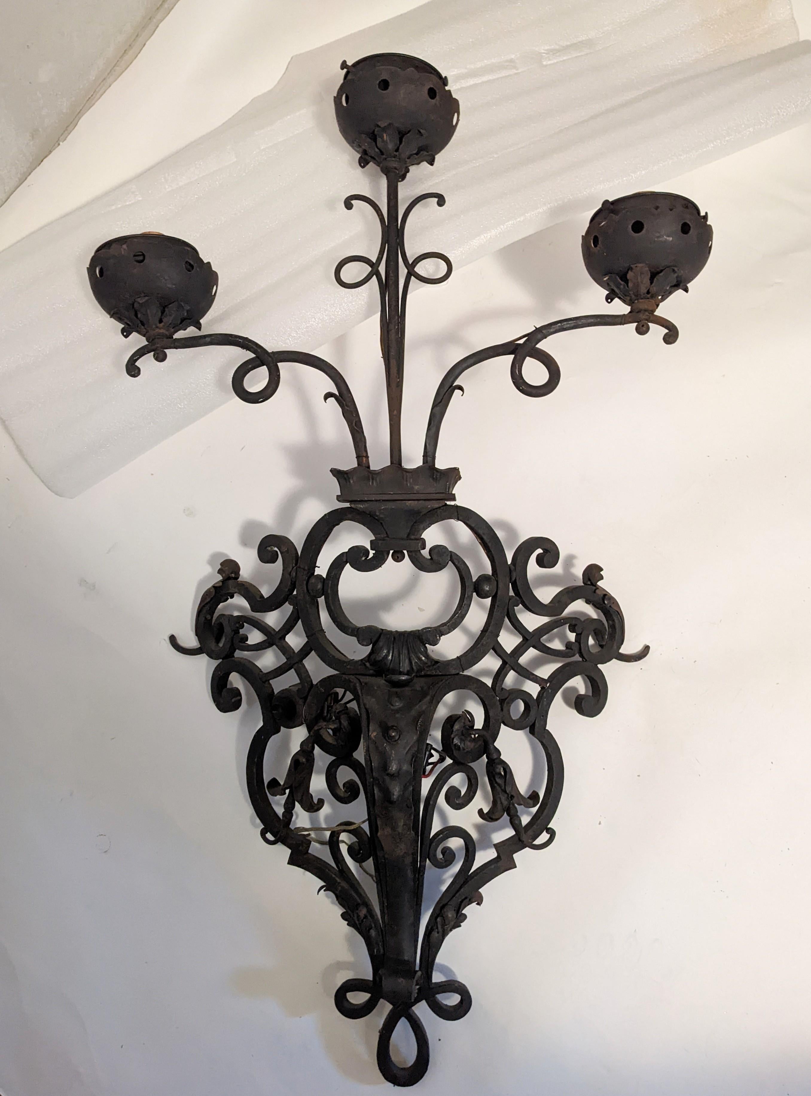 Mid-20th Century Pair of Massive French Wrought Iron Sconces with Frosted Flame Globes For Sale