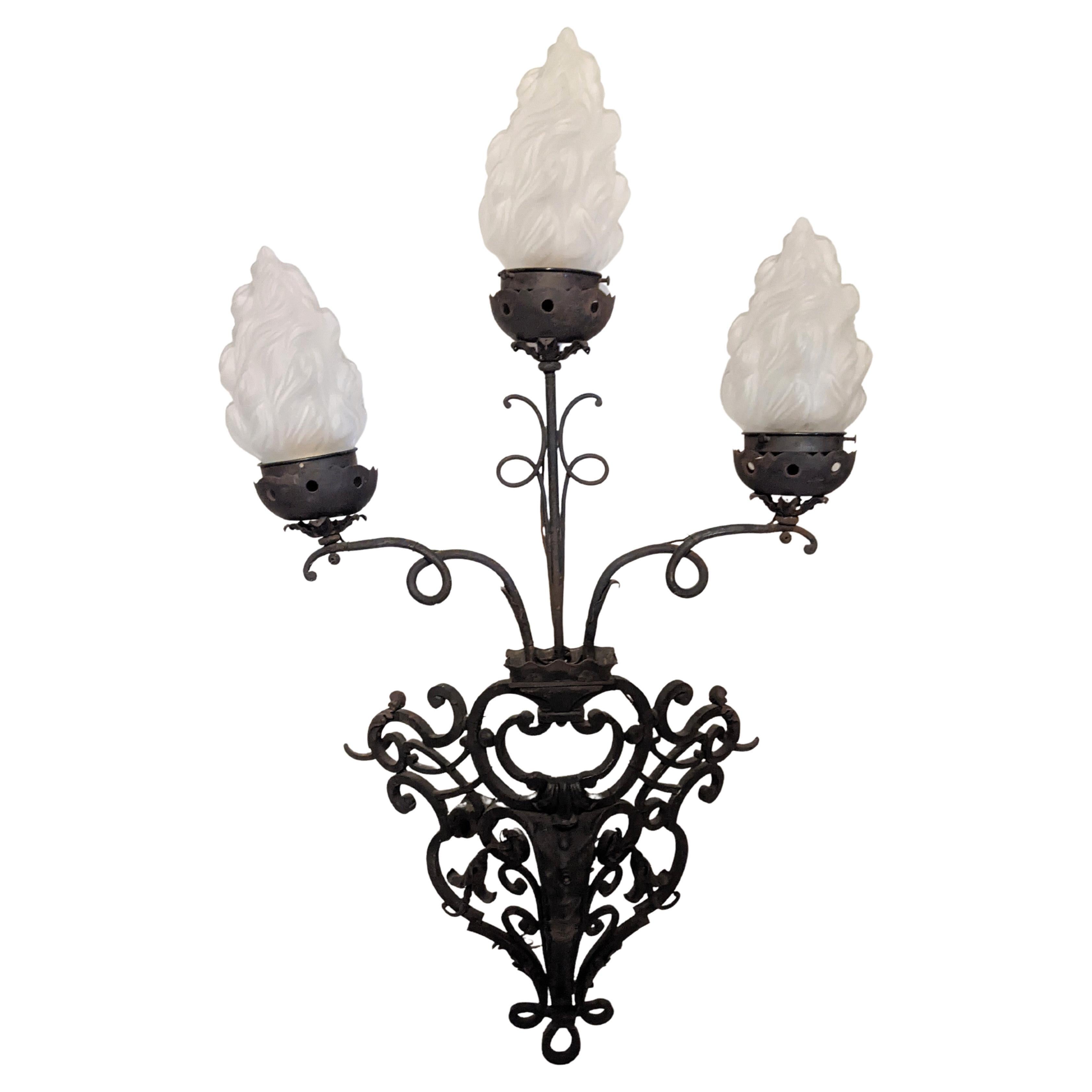 Pair of Massive French Wrought Iron Sconces with Frosted Flame Globes For Sale