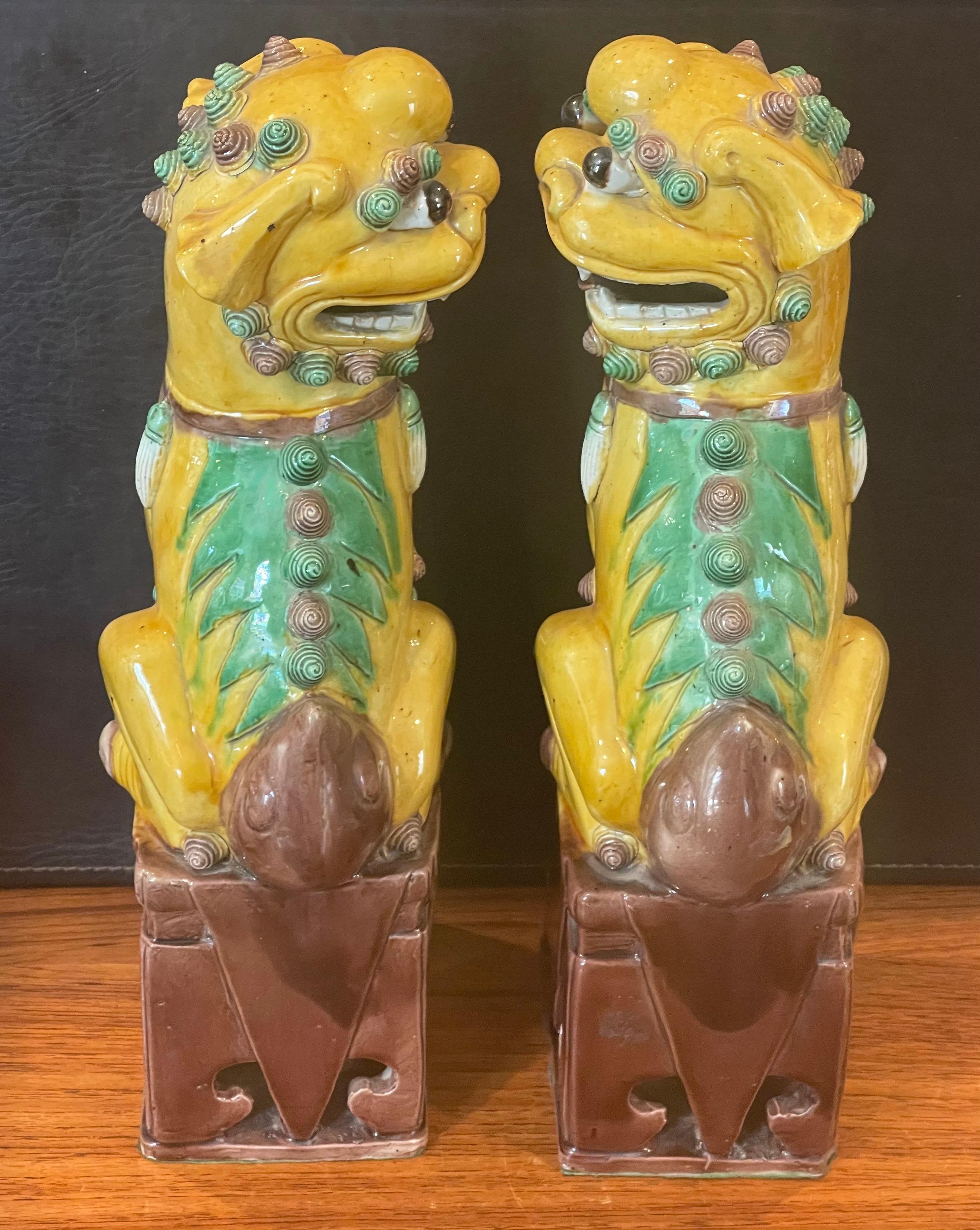 Chinese Pair of Massive Mid-Century Ceramic Polychrome Foo Dogs For Sale