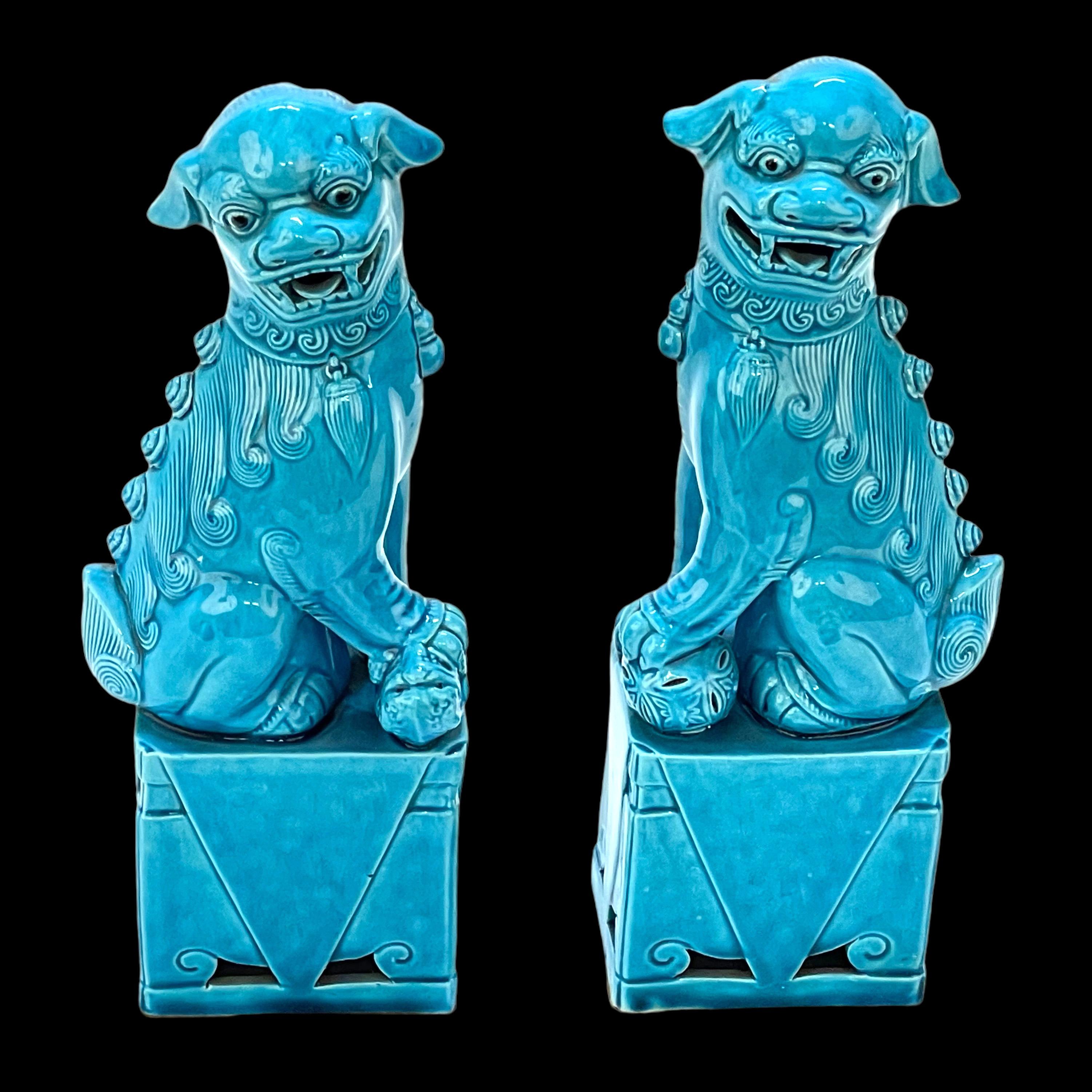 Excellent pair of mid-century turquoise blue ceramic foo dog sculptures, circa 1960s. These symbolic guardians present a beautiful turquoise hue and are in very good vintage condition with no chips or cracks.