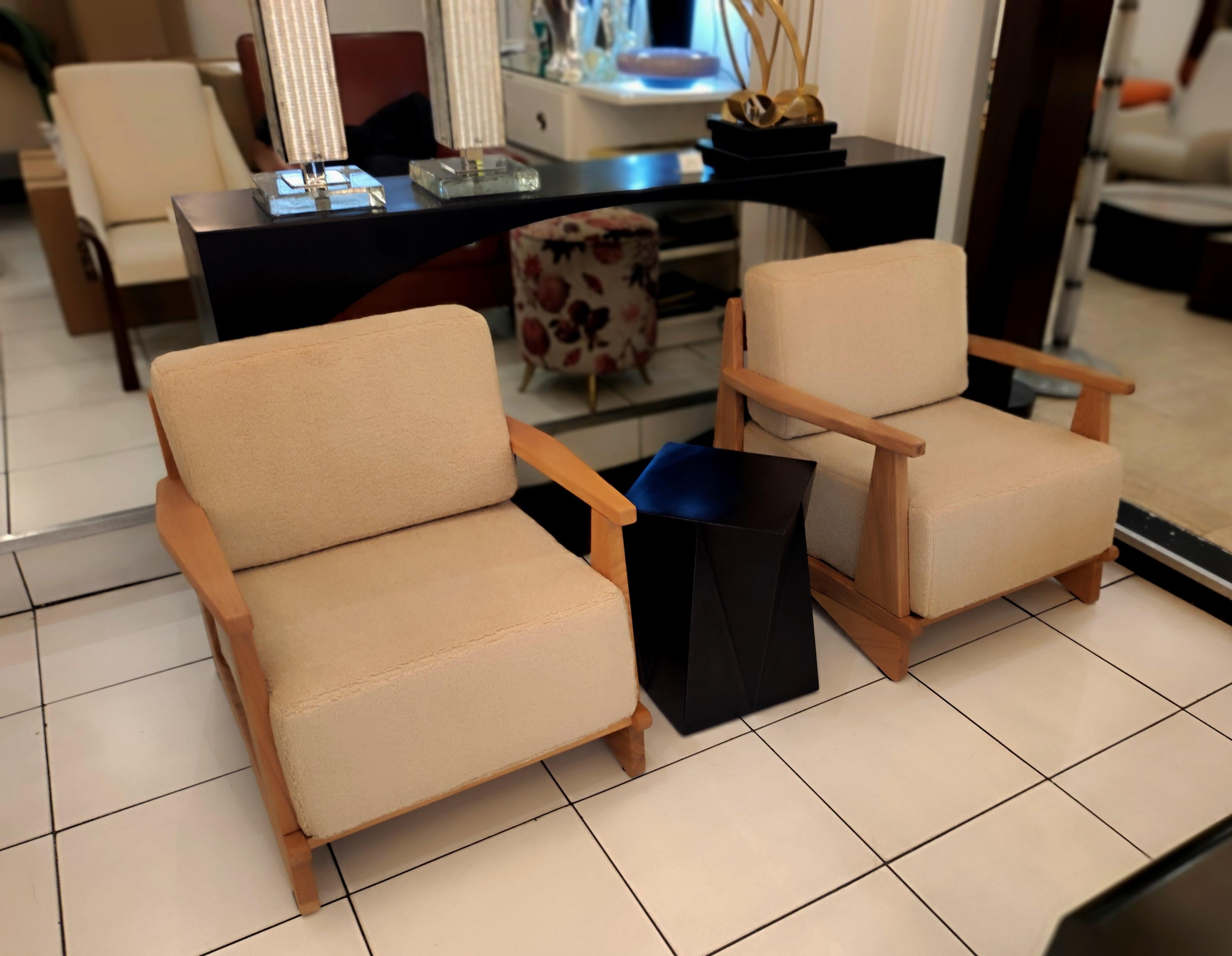 Pair of massive oak wood armchairs, Attb Maison Regain, reupholstered with beige bouclette fabric.