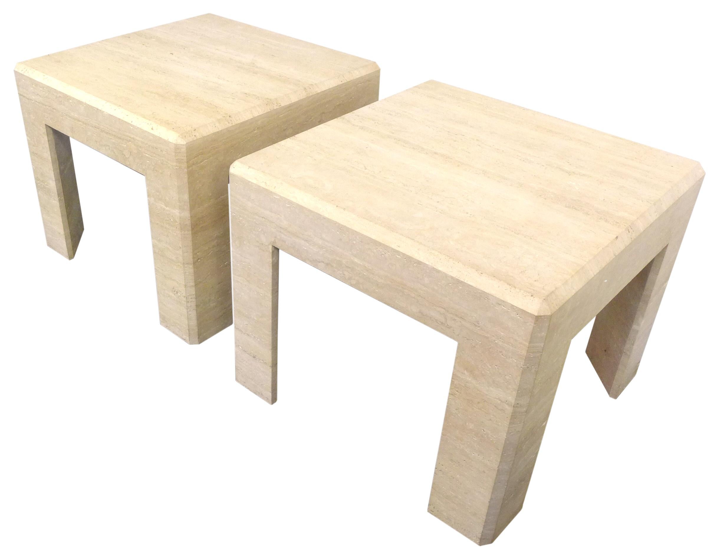 A fantastic pair of travertine side tables. Eye-catching, modern forms of great proportion and subtle detail. Though hollow underneath, mitered travertine slabs built to imply one massive structure with a decorative bevel along the top