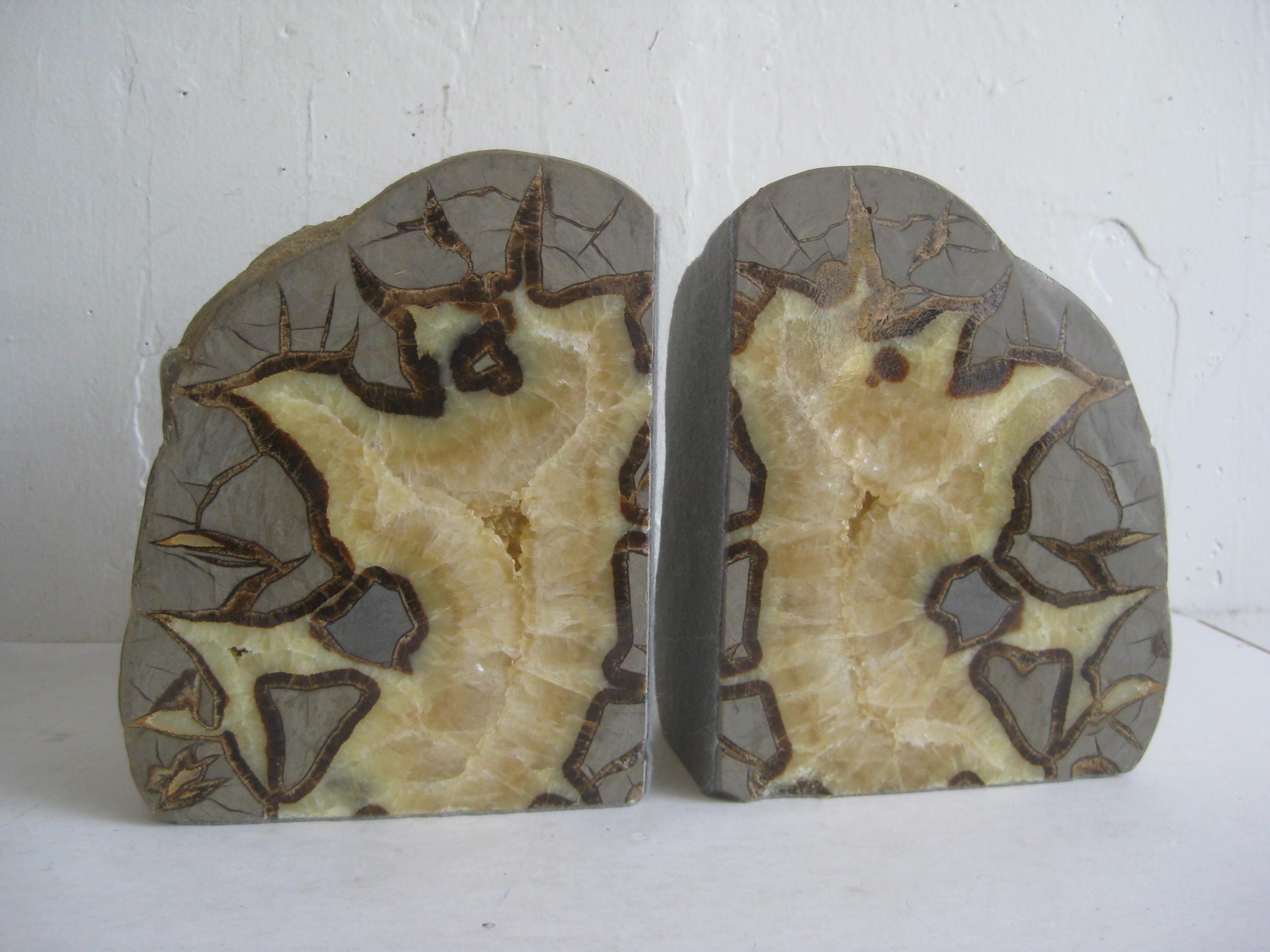 Beautiful pair of vintage natural geode bookends. This was a large stone that was split to make the bookends. Matching pair with a polished face. Has felt protective material on the two sides. Natural rock on the back. One has a little nick on the