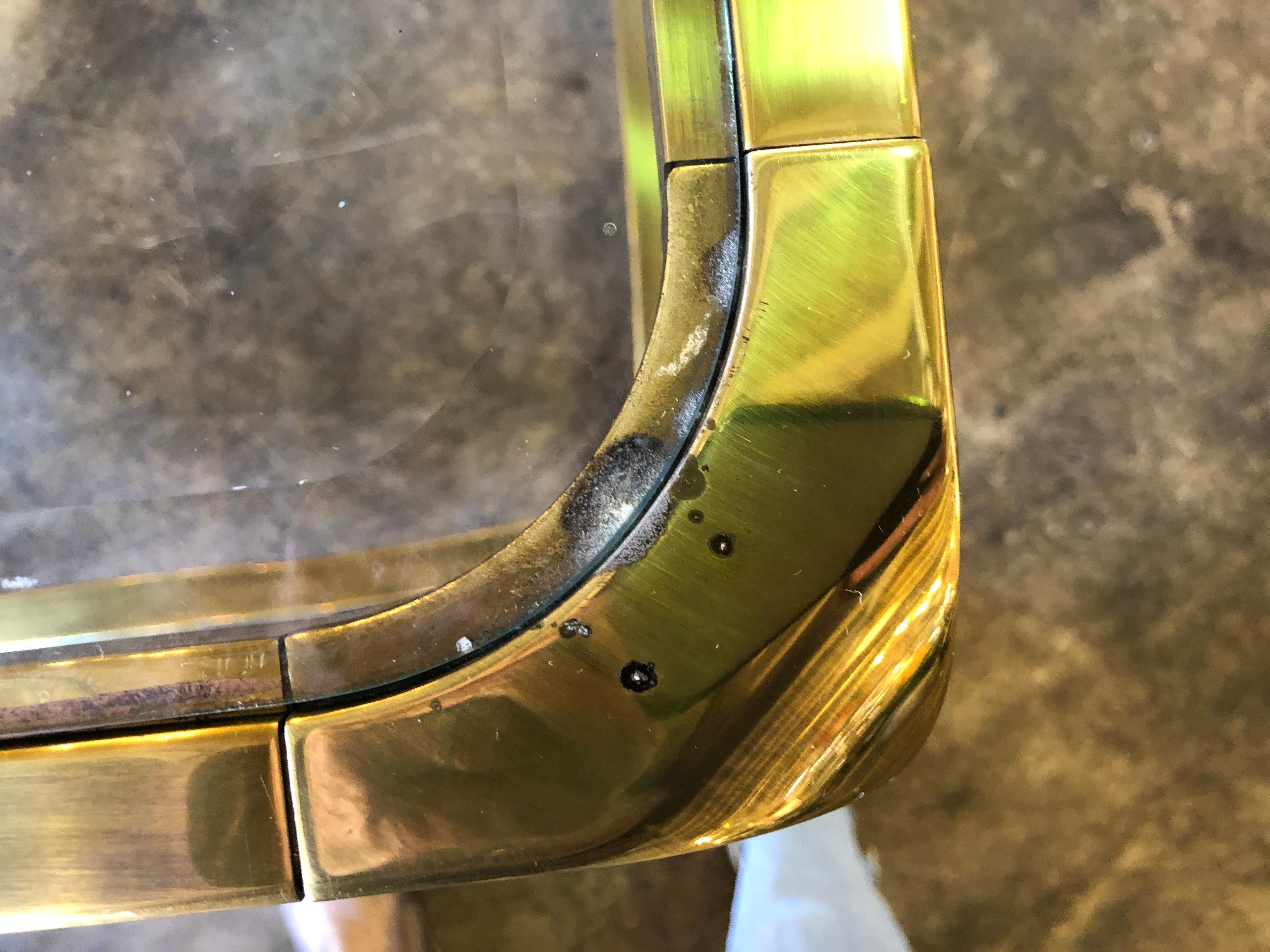 Pair of brass and glass side tables by Mastercraft.
