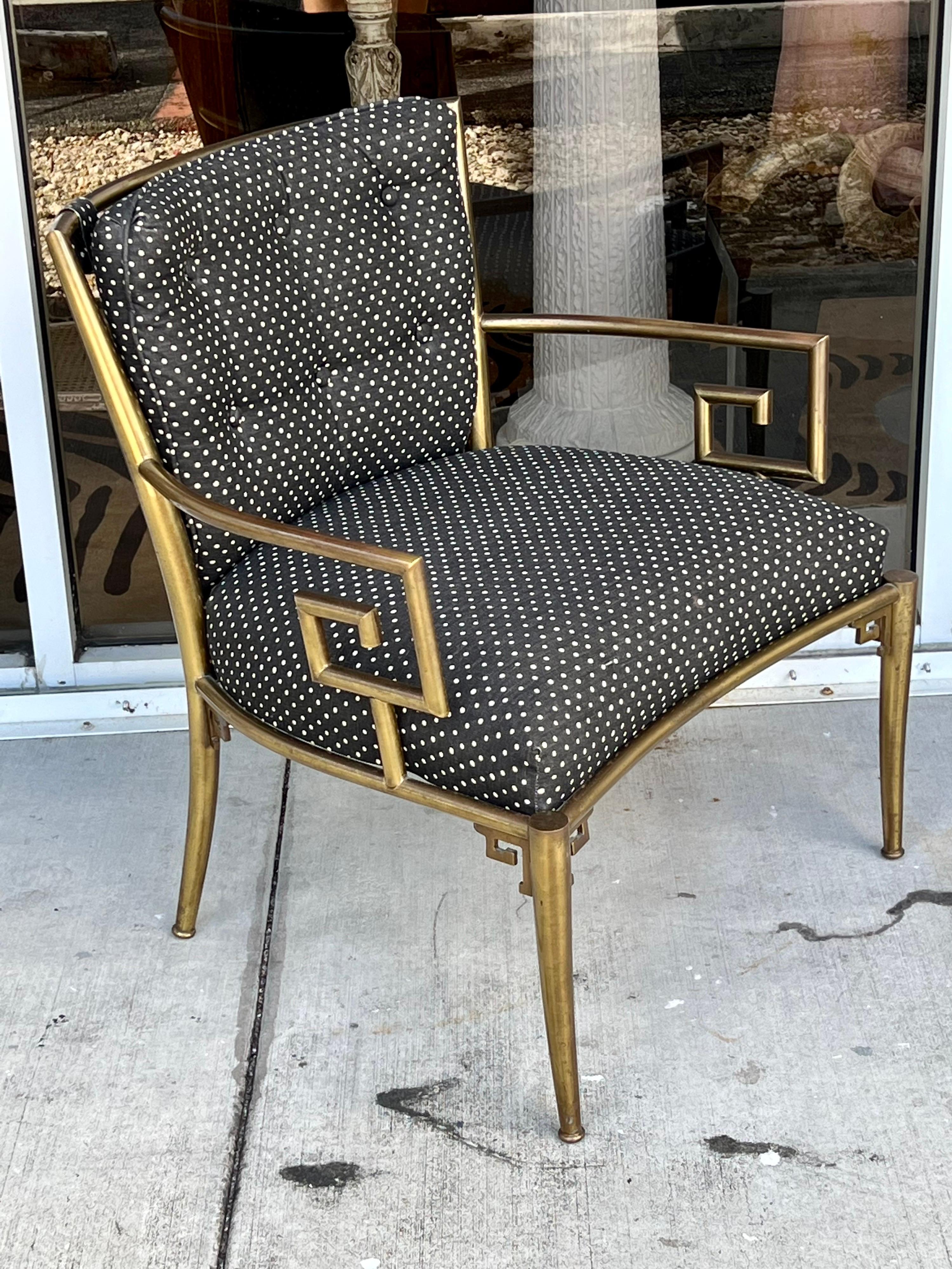 Pair of Mastercraft brass armchairs with upholstered seats.
Some patina on the brass that can be polished. Vintage upholstery in good condition, reupholstery recommended.
 
