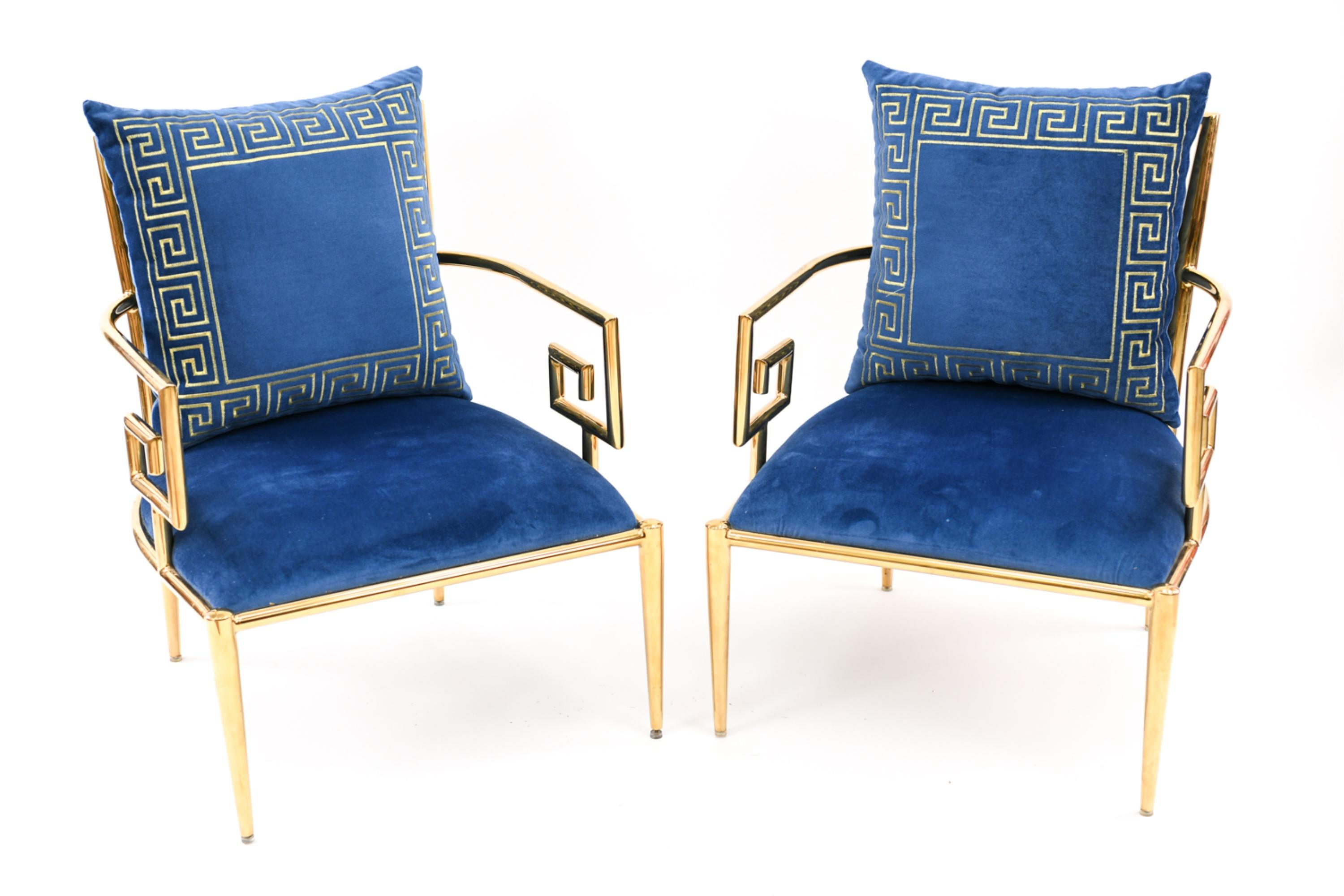 This exceptional pair of armchairs is presented with apparently original blue velvet twill upholstery, embroidered with metallic gold thread in a matching Greek key motif. Luxurious and comfortable, they are the epitome of Hollywood Regency-style