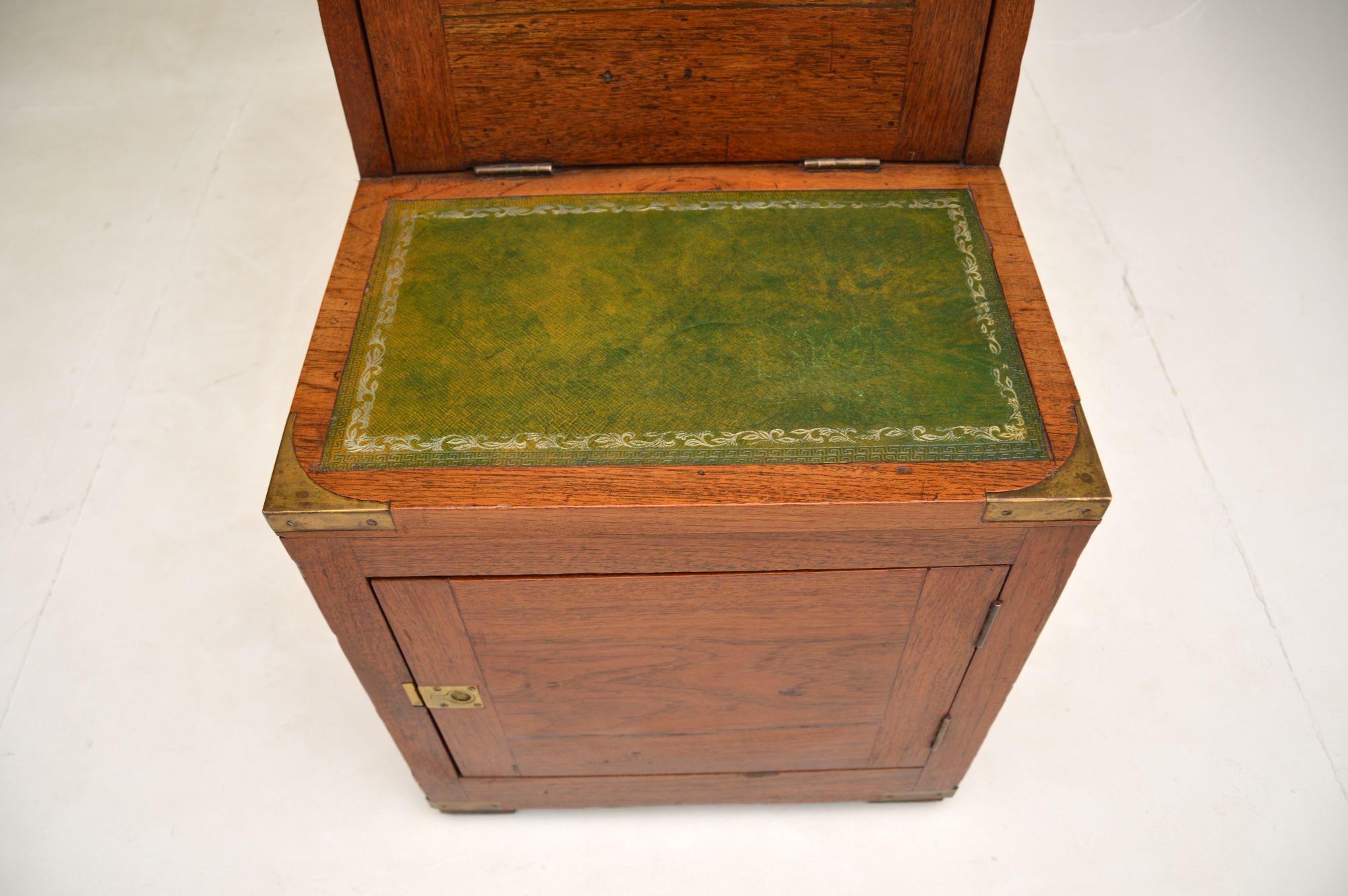 A wonderful and very unusual pair of solid oak antique cabinets in the military style. These were made in England, I would say they date from around the 1900-1910 period.
They are not quite identical, one is very slightly taller and the other is