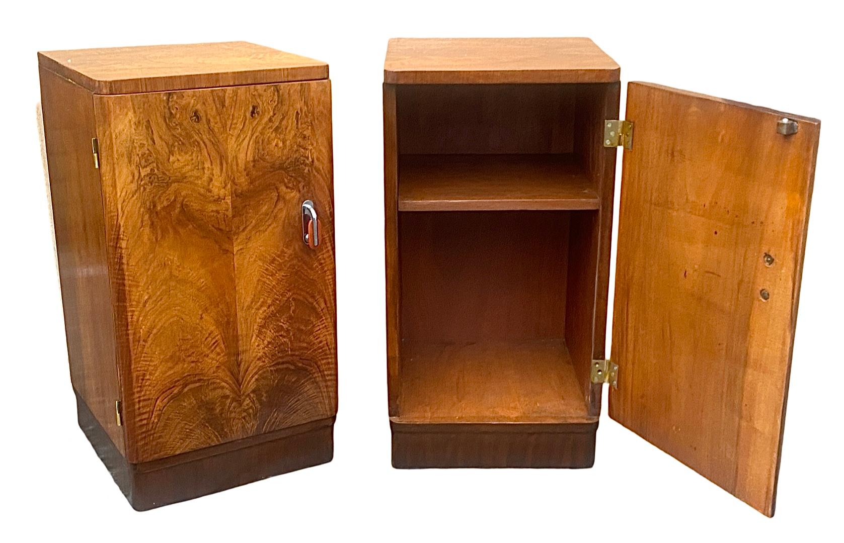 A matching pair of Art Deco Bedside Cabinets in gorgeous honey coloured figured walnut. The hinges have been removed and fully buffed. The cabinets are round shouldered and the doors open to reveal a fitted shelved interior with ample storage.