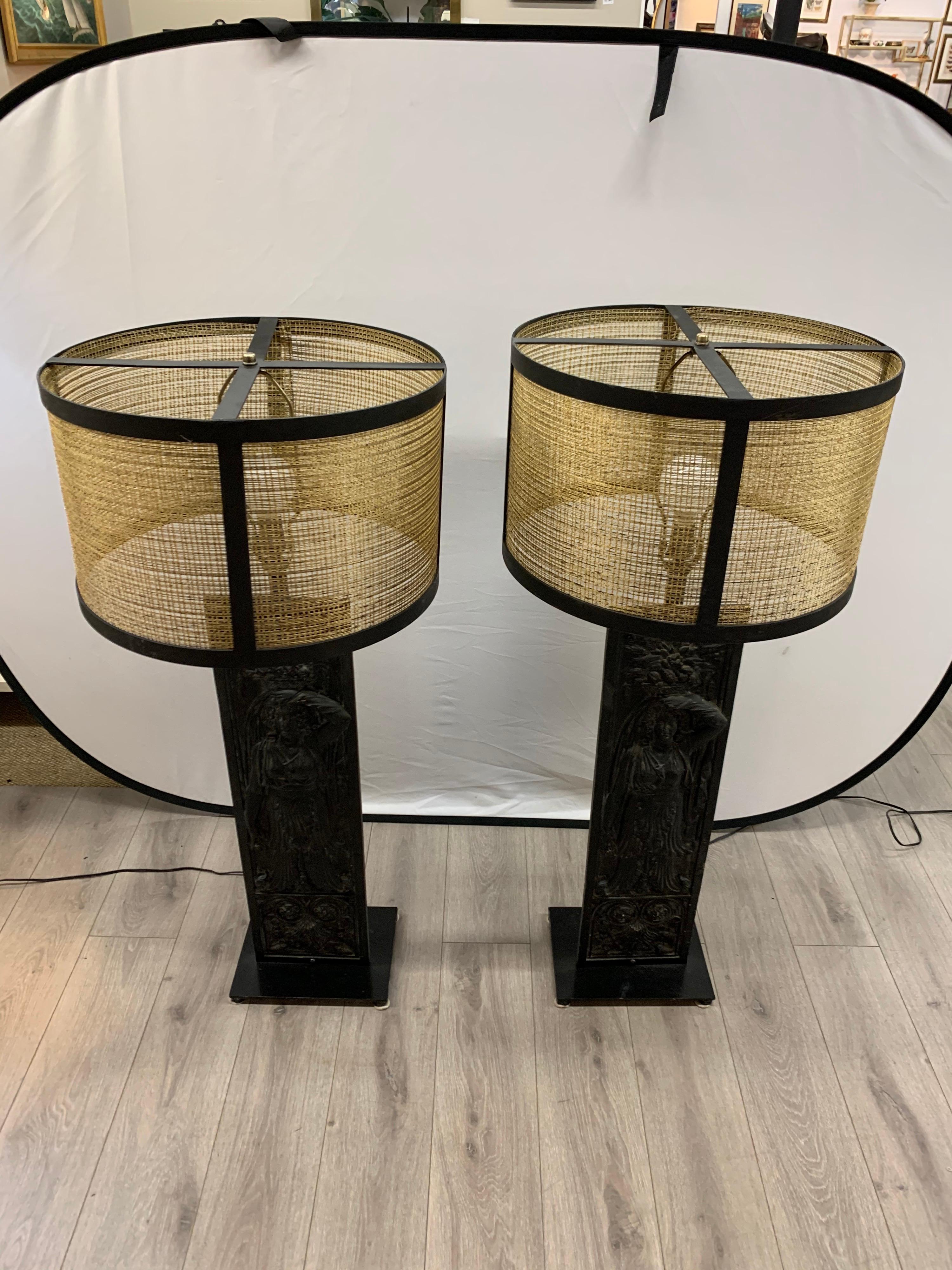 Rare pair of antique wrought iron panels that have been converted into matching table lamps. The detail on the wrought iron is magnificent. Wire for USA and in perfect working order. Now, more than ever, home is where the heart is.