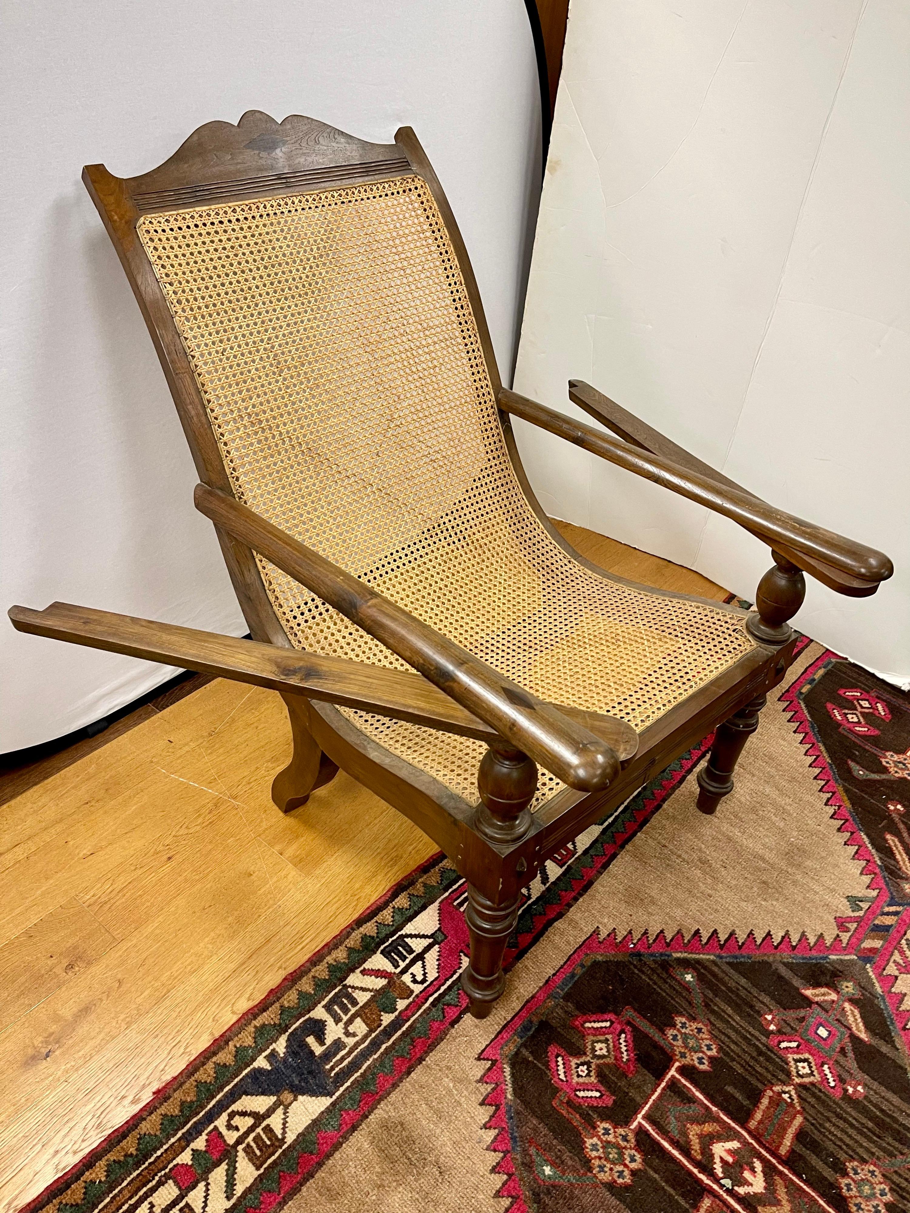 Pair of Matching British Colonial Cane Plantation Chairs with Pullout Leg Rests 11