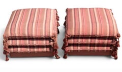 Pair of Matching Custom-Made Pillow Stacked Ottomans on Casters With Tassels