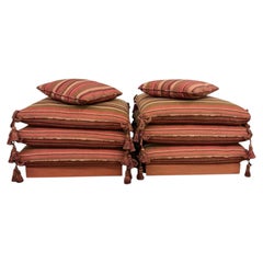 Pair of Matching Custom-Made Pillow Stacked Ottomans on Casters With Tassels