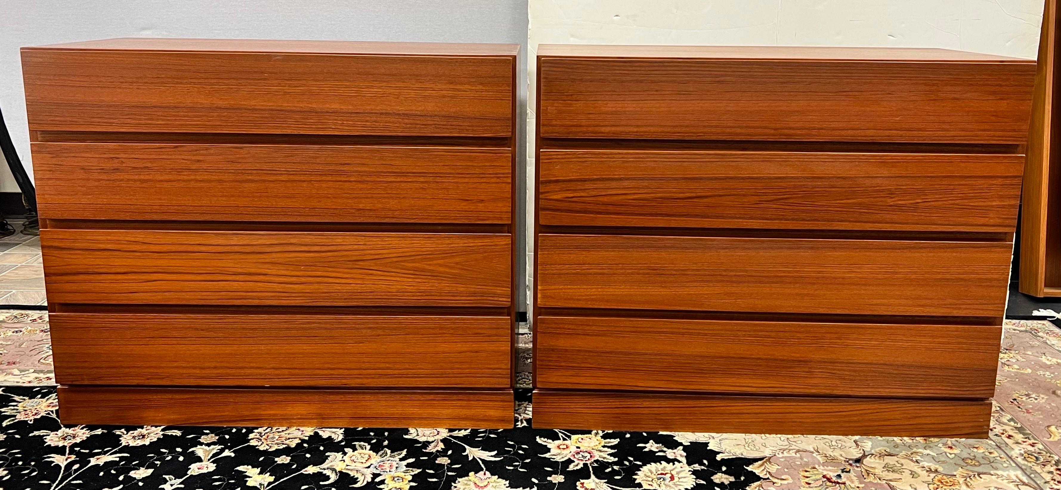Exquisite pair of matching Arne Wahl Iversen four drawer teak dressers. All original
with Danish Control hallmarks. This piece offers plenty of storage including four dovetailed drawers with inset sculpted handles that run across the entire front.