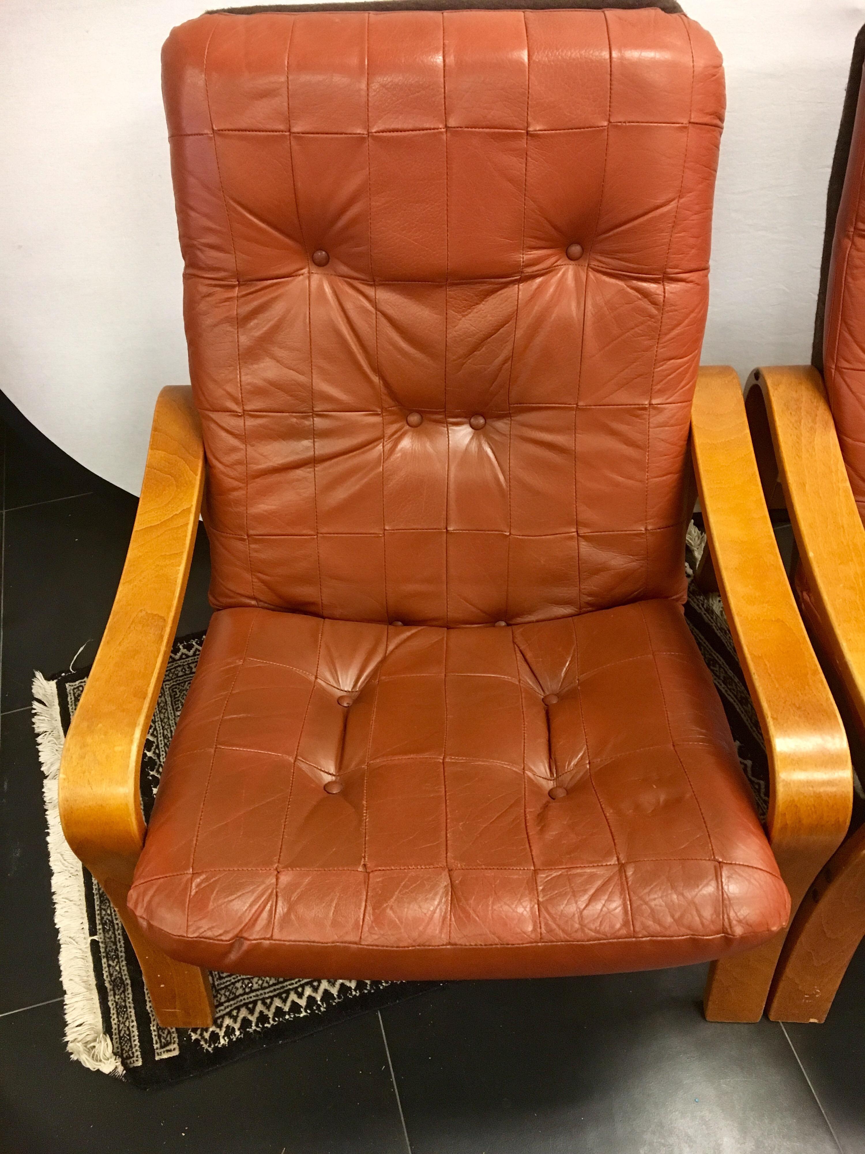 Mid-Century Modern Pair of Danish Modern Teak and Tufted Leather Lounge Chairs