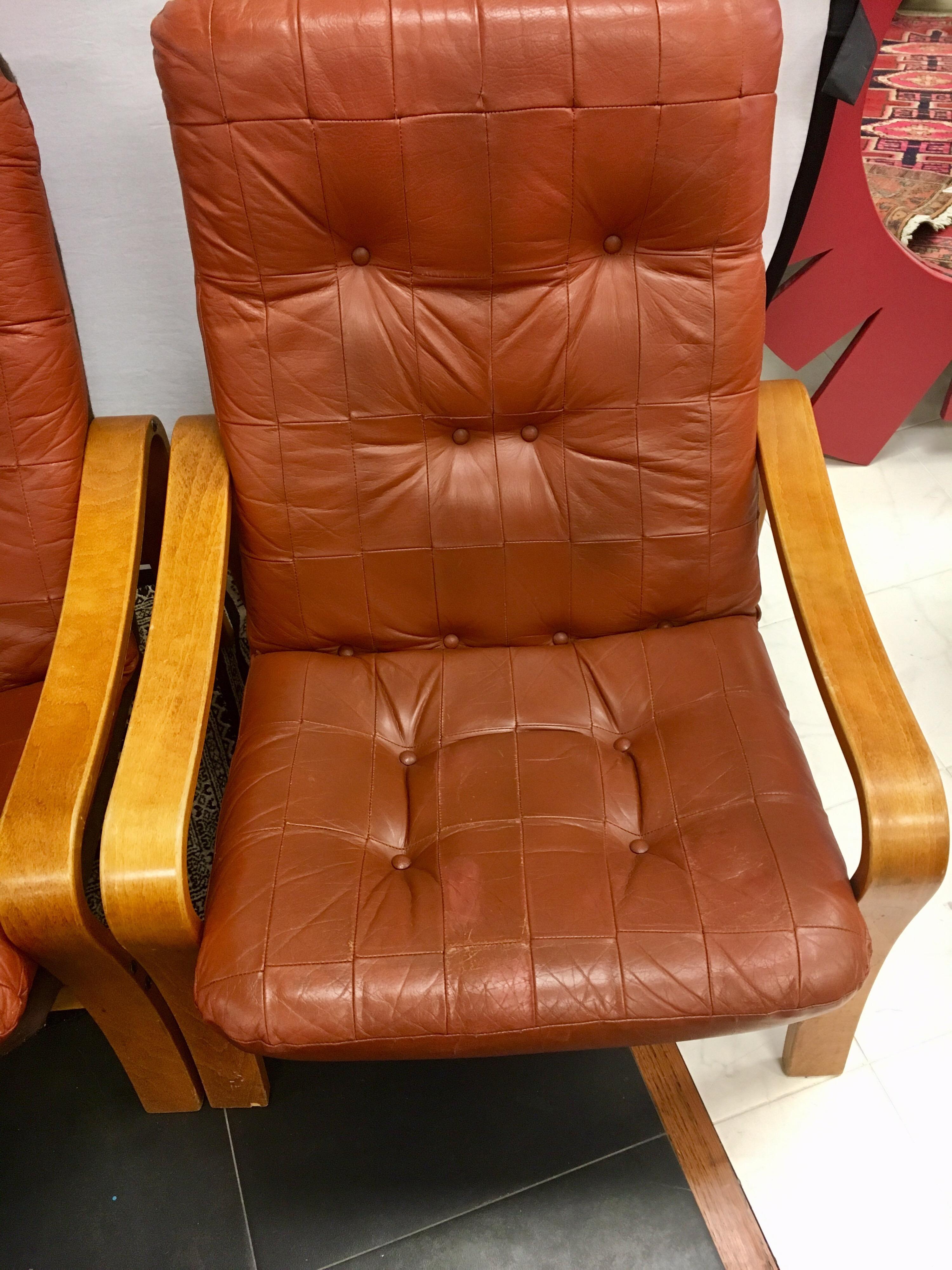 Scandinavian Pair of Danish Modern Teak and Tufted Leather Lounge Chairs