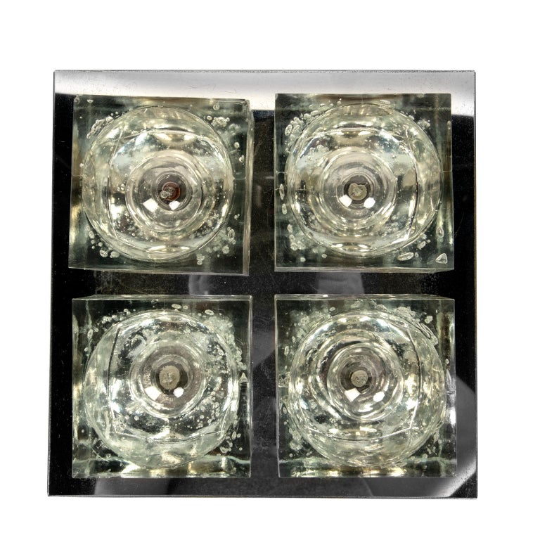 These are stunning thick, heavy glass flush mount lights for Lightolier by Gaetano Sciolari and date from
the mid 1970's. The beauty of these lights is that they may also be used as wall sconces.