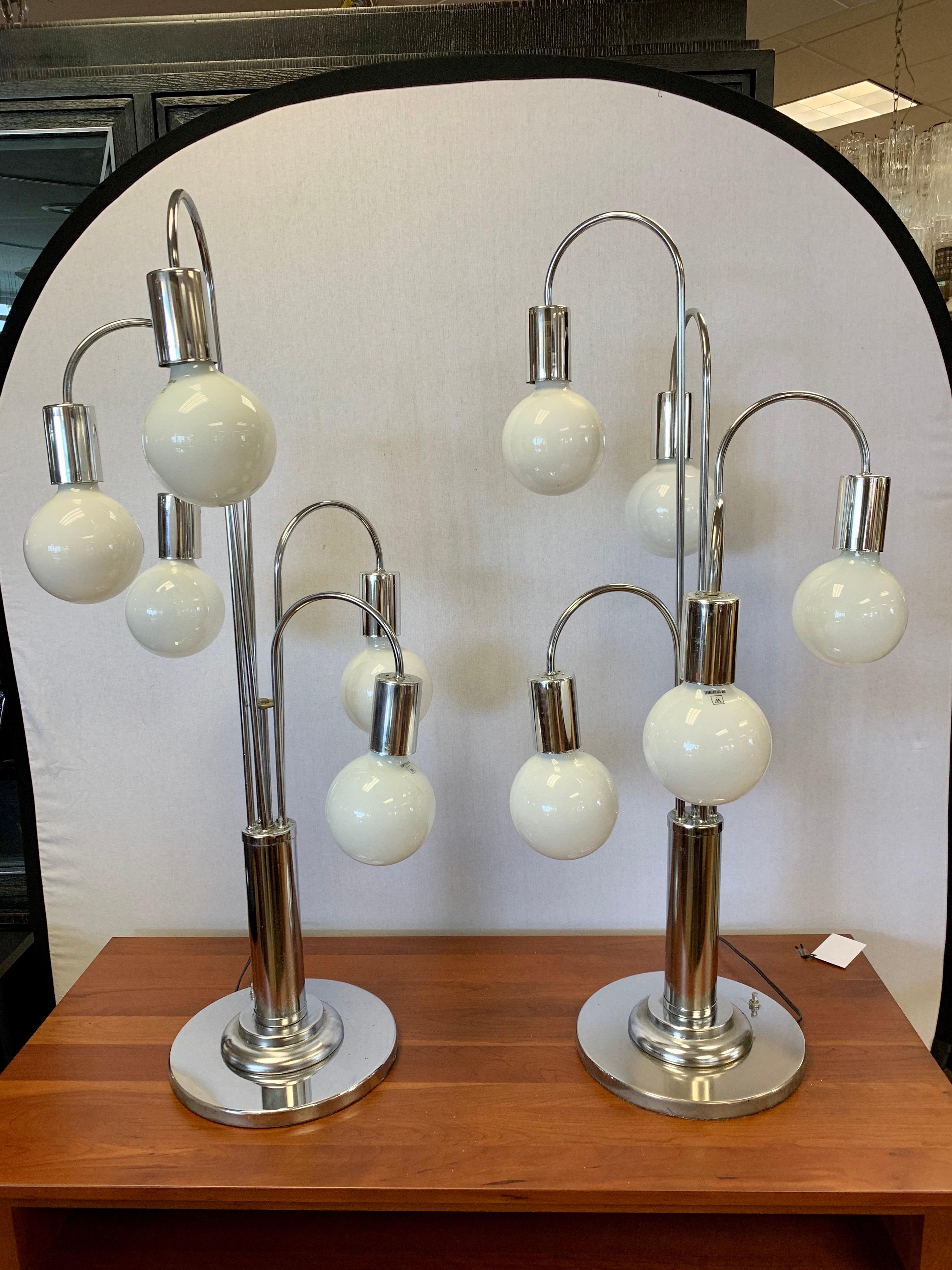 Ultra rare matching pair of Laurel Lamp Company large chrome waterfall table lamps. There are five lights and these pieces are made to look like cascading chandeliers. They measure forty inches tall and are nothing short of magnificent. Made and