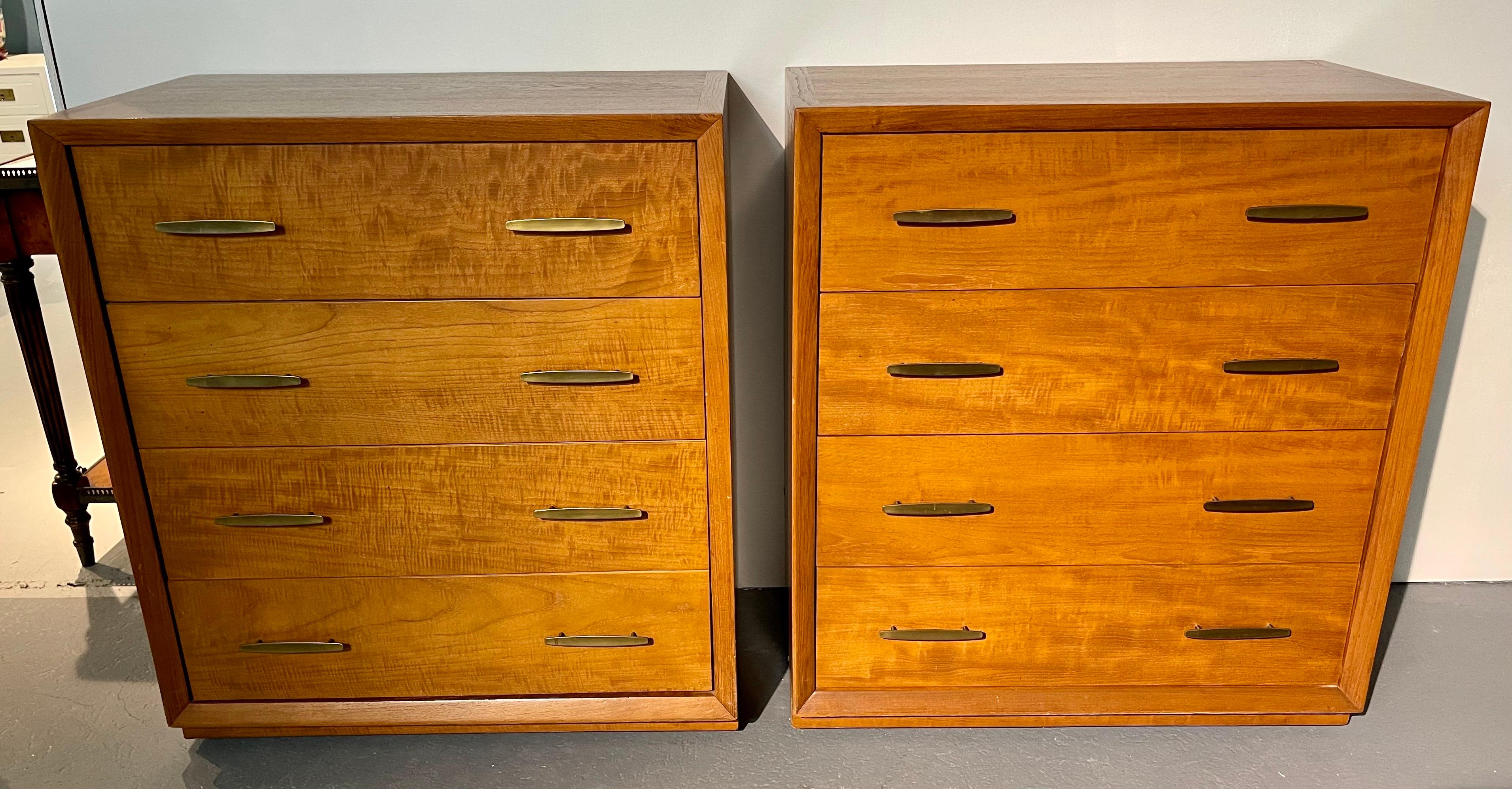 Stylish pair of matching teak and walnut mid century dressers with sleek hardware. Dovetailed drawers throughout. Iconic minimalist design perfect for any home or apartment. Own the best.