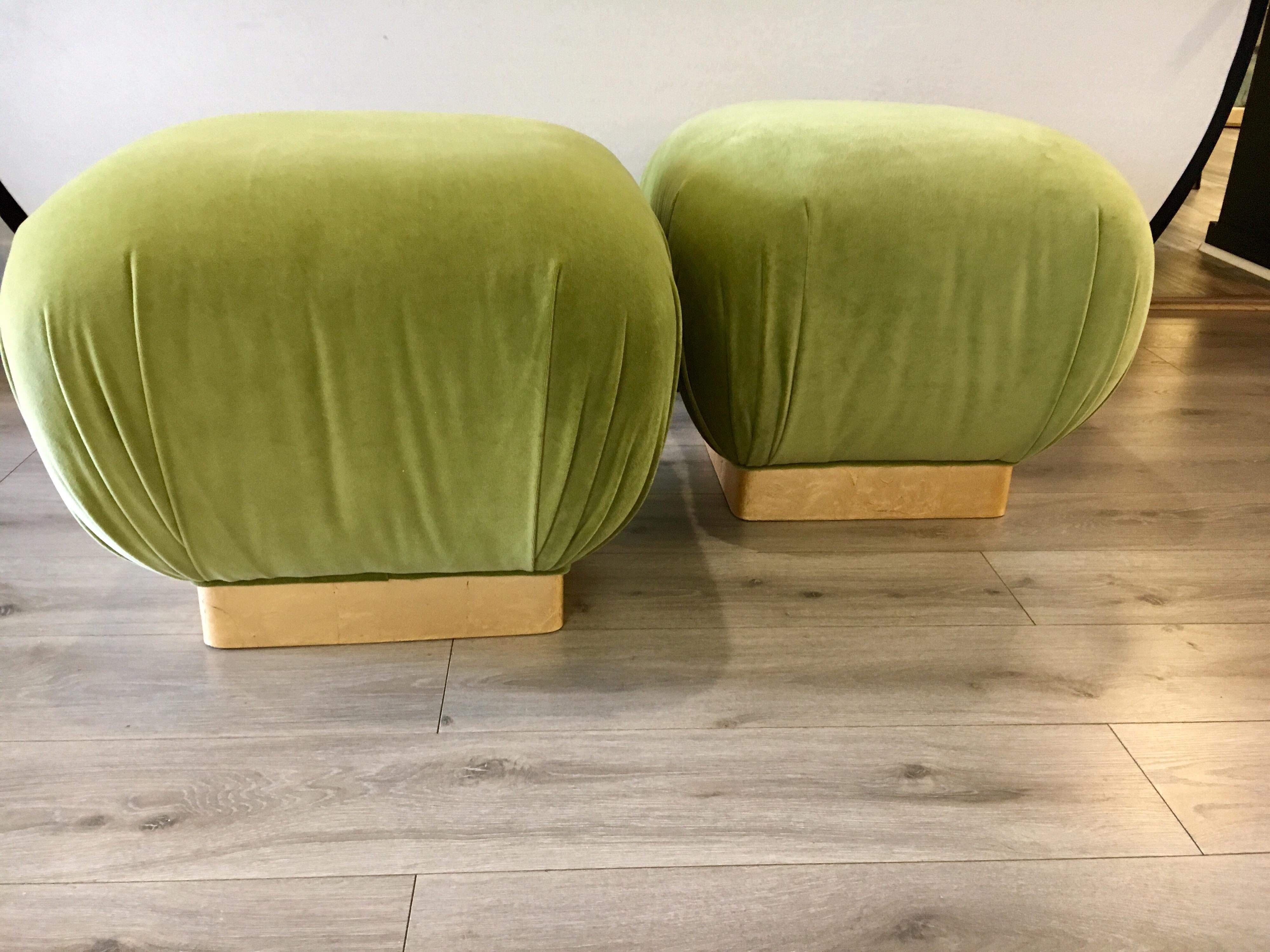 Great looking pair of matching poufs with Milo Baughman style brass banding at bottom. The shade of green on the fabric is vibrant and vivid.