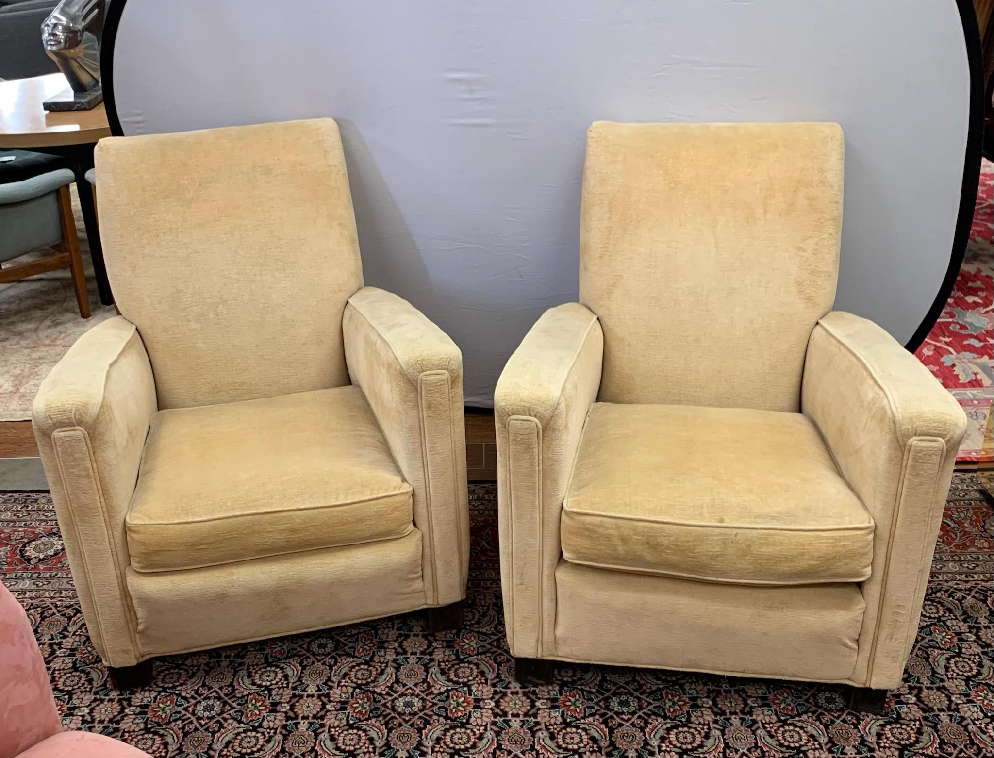 An elegant pair of matching Art Deco style club chairs upholstered in a table ale gold colored velvet fabric that is in decent condition. Exceptional minimalist lines.
Perfect for any living area, office or library. Own the best.