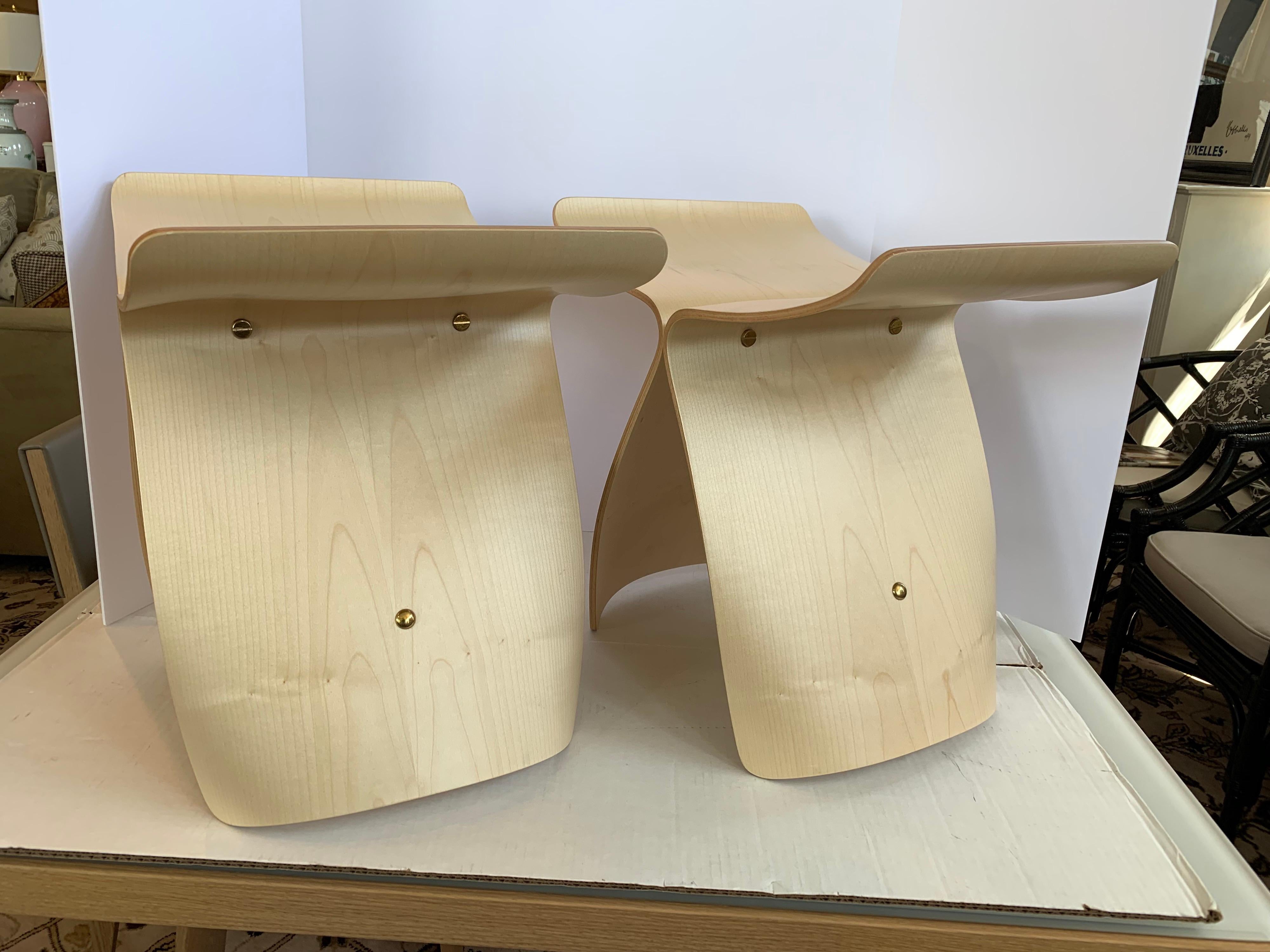 These matching butterfly stools uniquely combine Eastern forms with the plywood molding technique developed by Charles and Ray Eames. The gently curving silhouette reminiscent of a butterfly‘s wings and is made of molded plywood with a lacquer