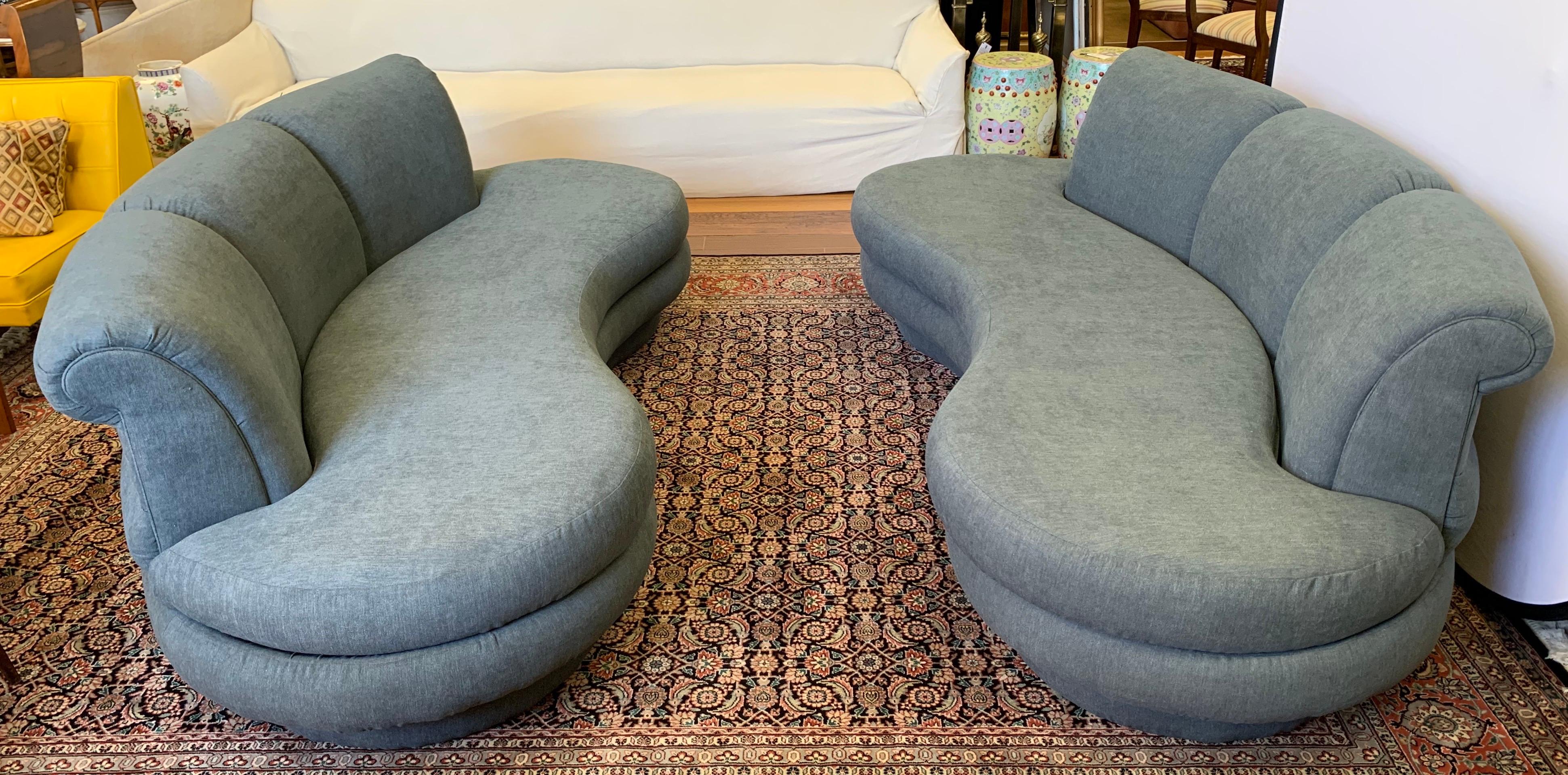Newly upholstered in a luxurious slate gray cotton blend fabric, this set of two matching Adrian Pearsall Cloud seven foot sofas have the lines, scale and comfort that make them so coveted.
We are selling this set of Pearsall sofas exclusively on