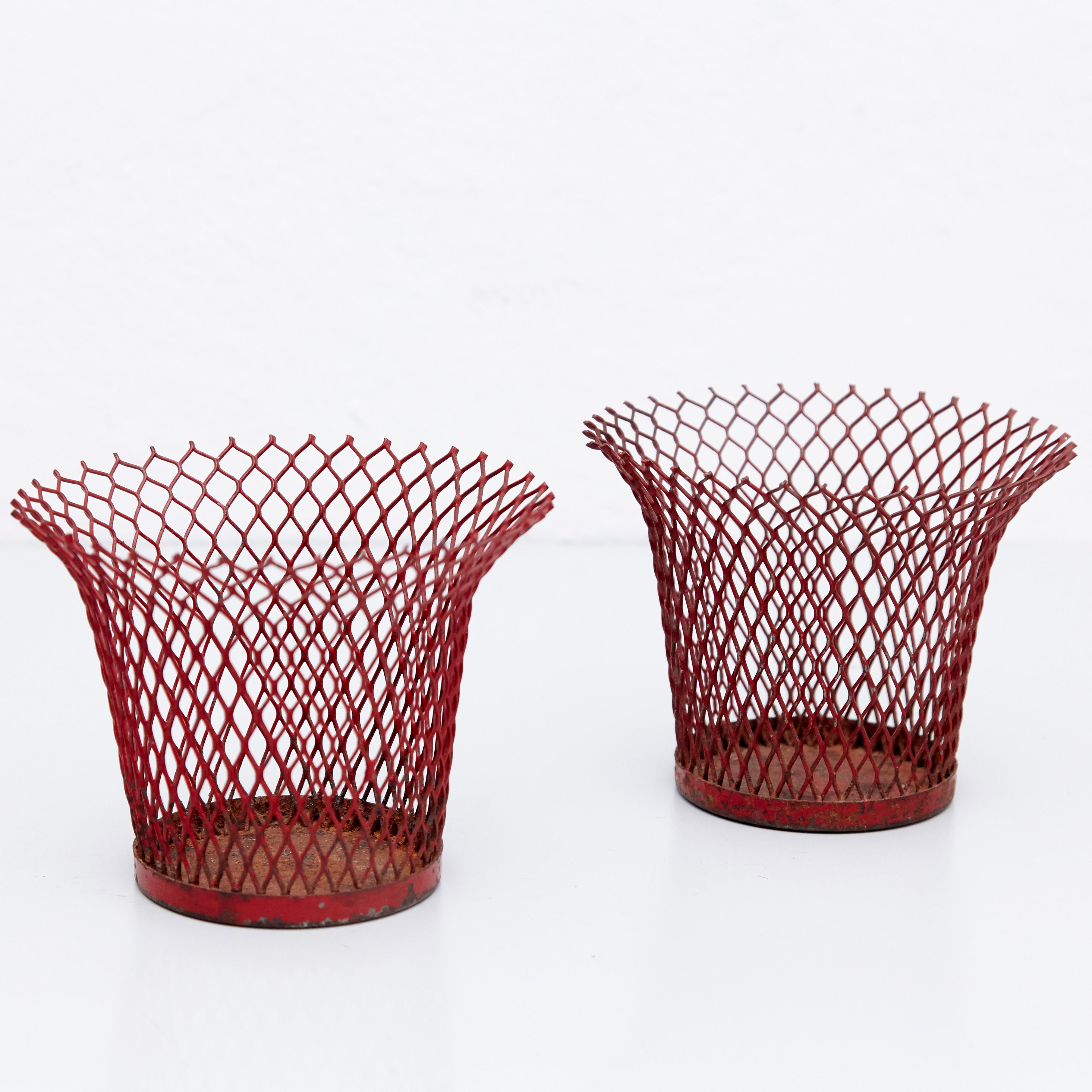 Enameled metal baskets designed by Mathieu Mategot.
Manufactured by Ateliers Mategot (France,) circa 1950.
Lacquered perforated metal, it has some traces of rust.

In original condition, with wear consistent with age and use, preserving a