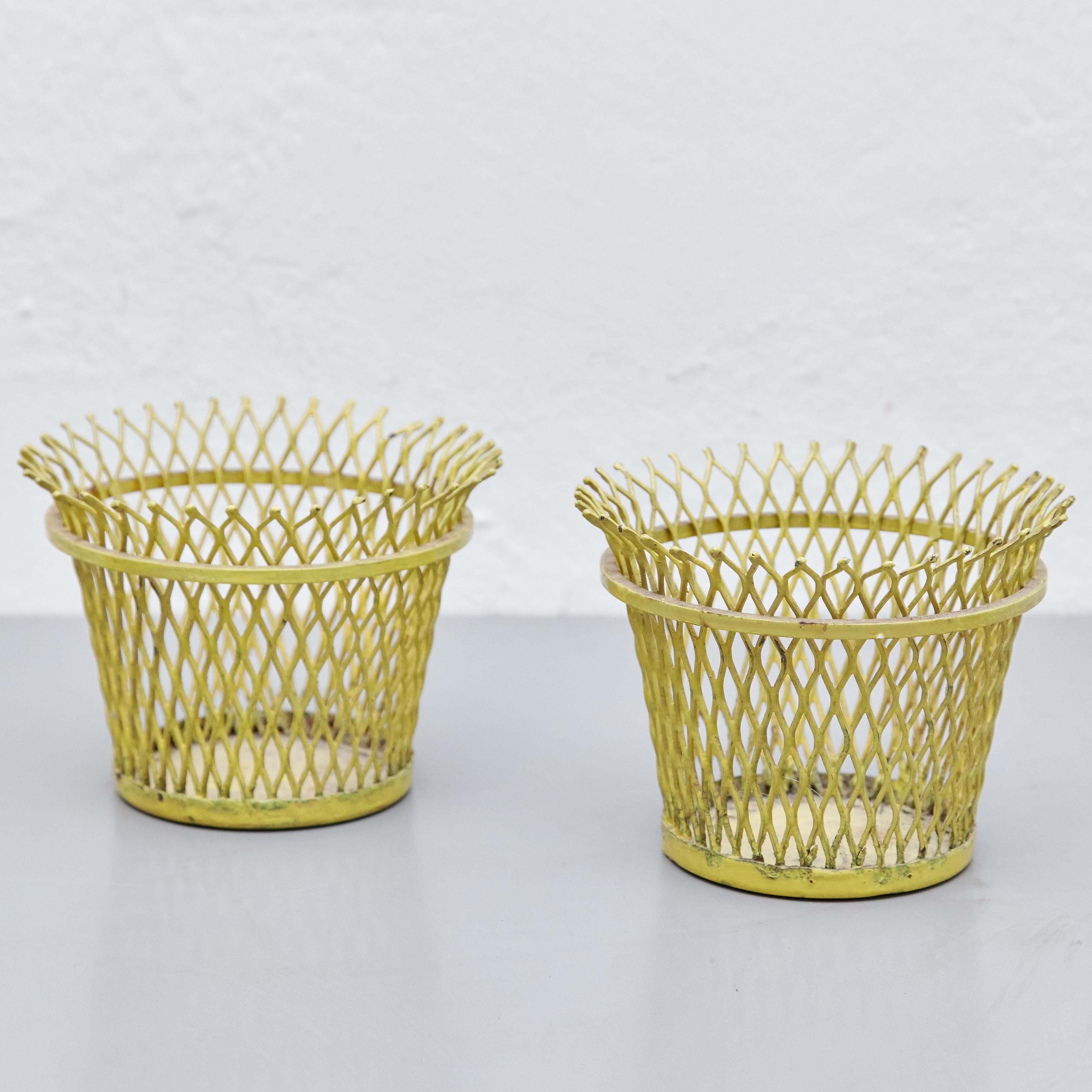 Enameled metal baskets designed by Mathieu Mategot.
Manufactured by Ateliers Mategot (France,) circa 1950.
Lacquered perforated metal, it has some traces of rust.

In original condition, with wear consistent with age and use, preserving a